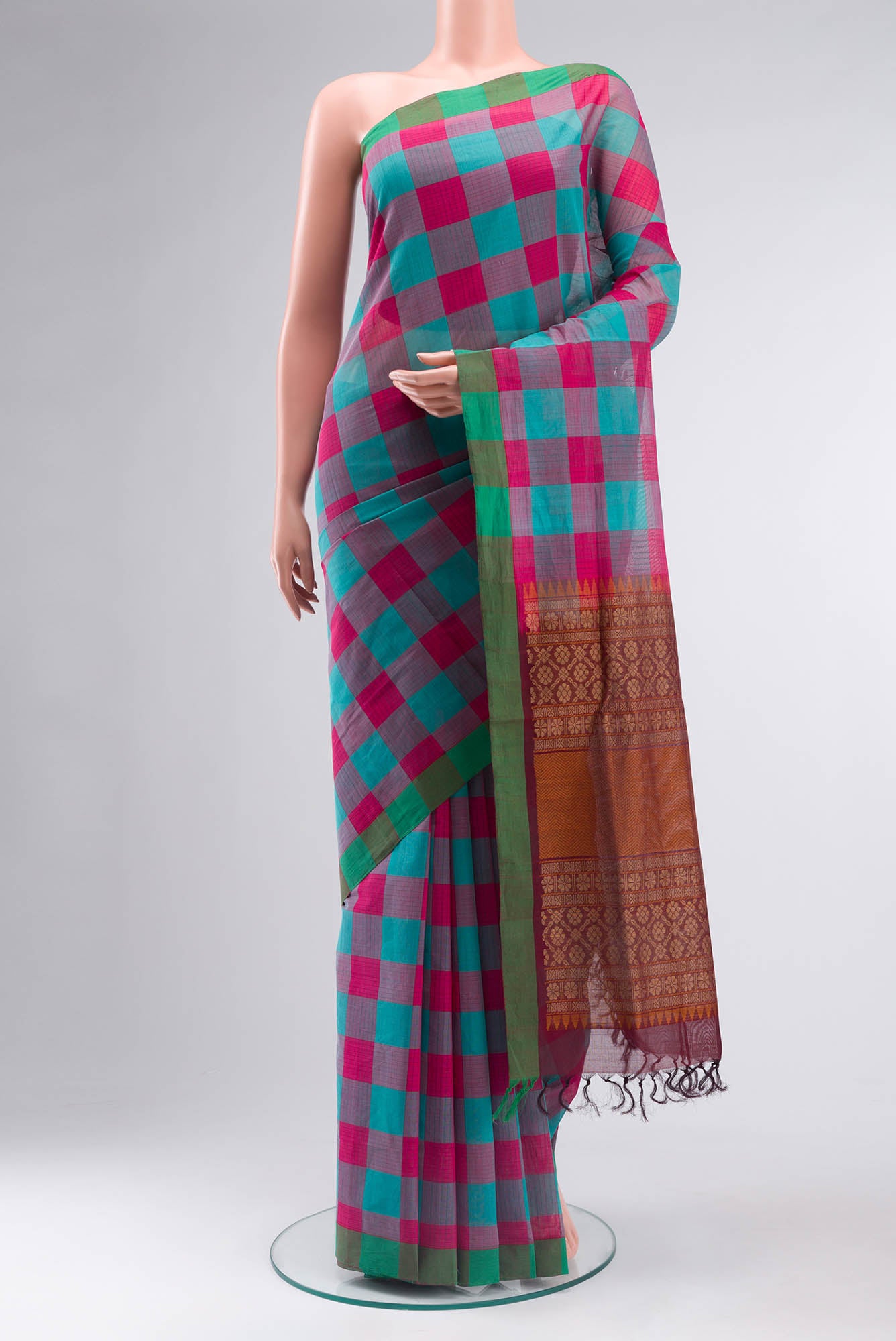 Multi Color Coimbatore Cotton Saree with Checked design on the body and Plain Border.  displayed on a mannequin
