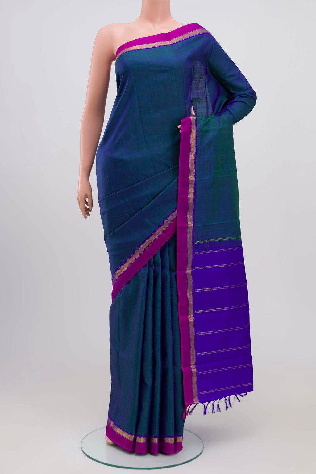 Blue with Green Color Kanchipuram Silk Saree with Plain Body and Zari Border.  displayed on a mannequin