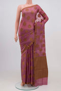 Mauve Banarasi Tussar Silk Saree with Thread Butta on the body and Thread Border.  displayed on a mannequin