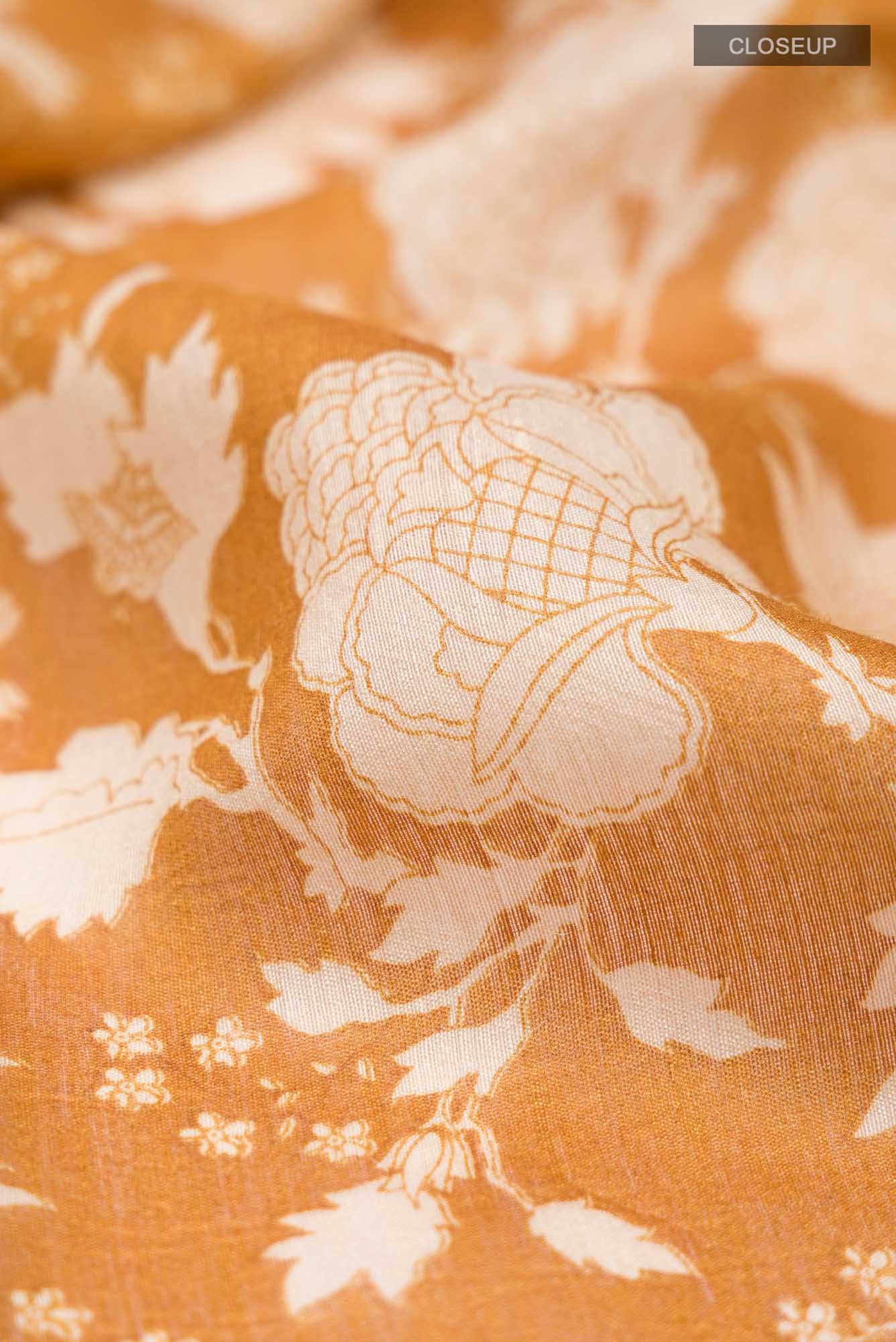 Close up of Yellow Bhagalpuri Tussar Silk Saree with Floral Print on the body and Zari Border.  displaying folds
