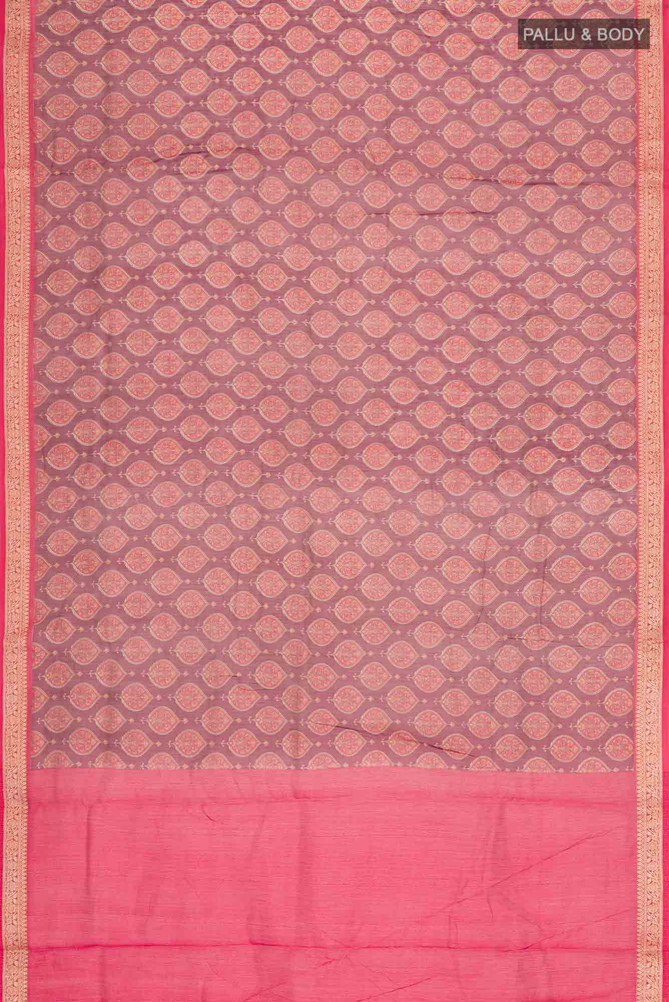 Flat view of Maroon Silk Cotton Saree with Floral Print on the body and Zari Border. 