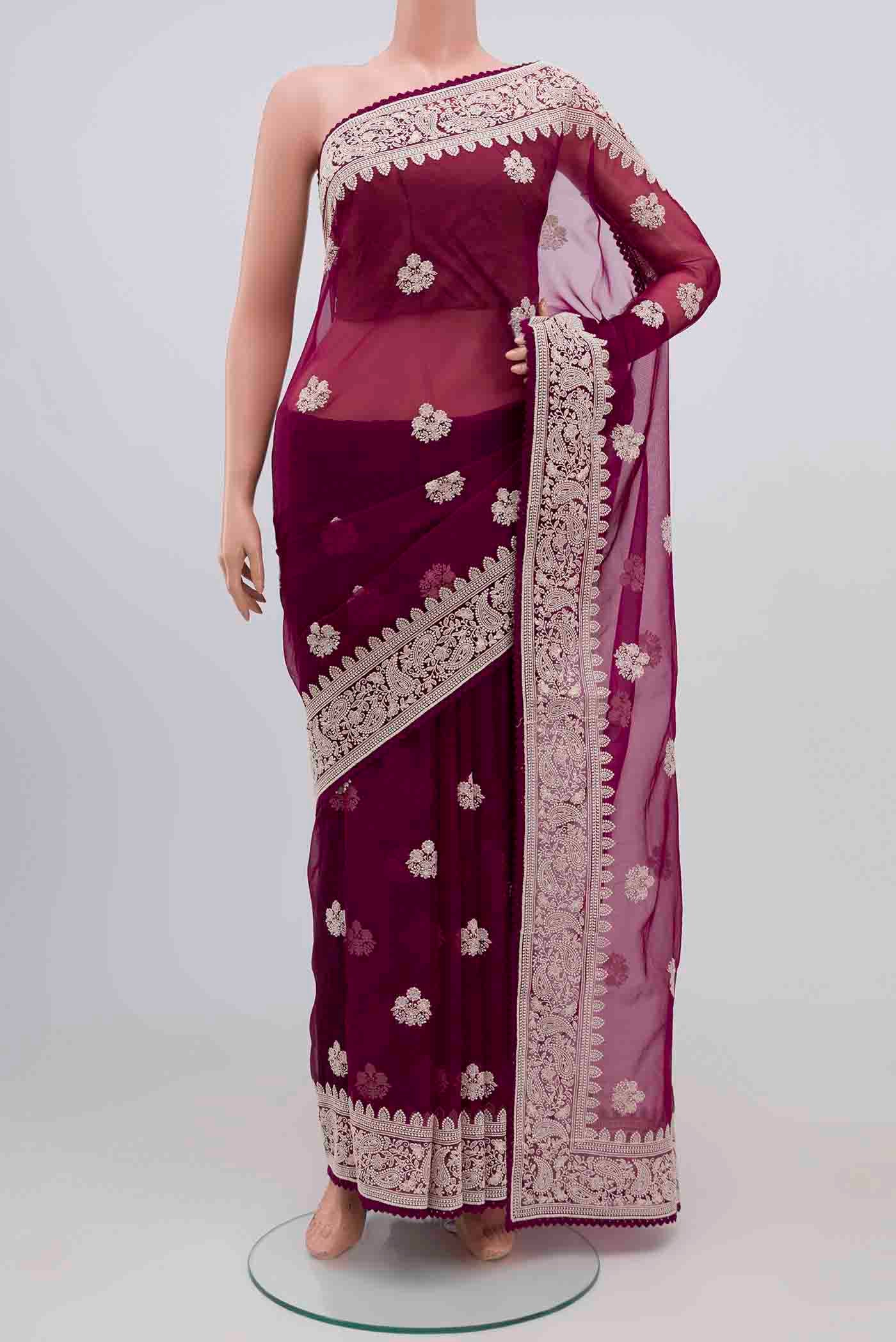 Magenta Blended Organza Silk Saree with Embroidery on the body and Embroidery Border.  displayed on a mannequin