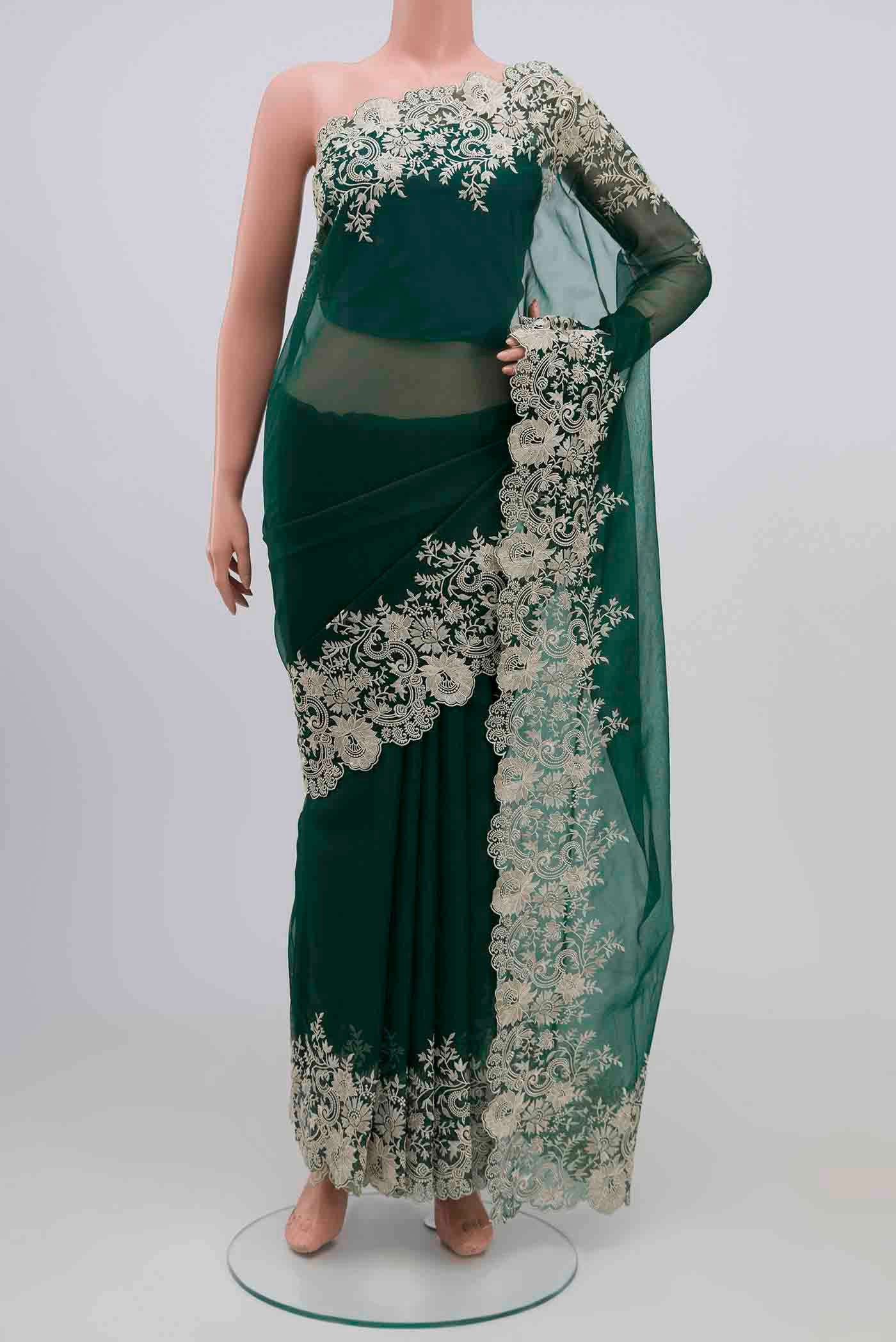 Green Blended Organza Silk Saree with Plain Body and Embroidery Border.  displayed on a mannequin