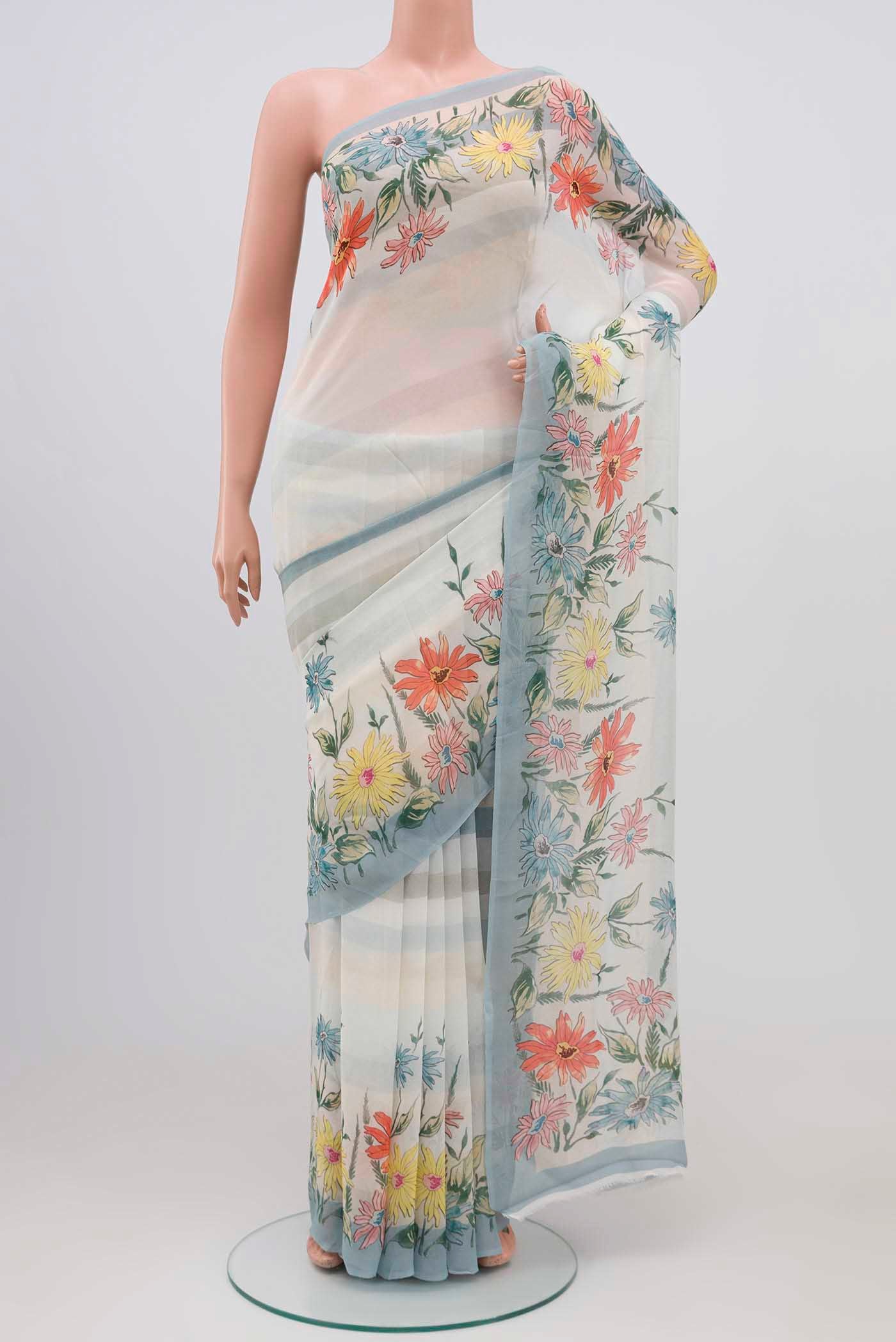 Blue Blended Georgette Saree with Printed design on the body and Printed Border.  displayed on a mannequin