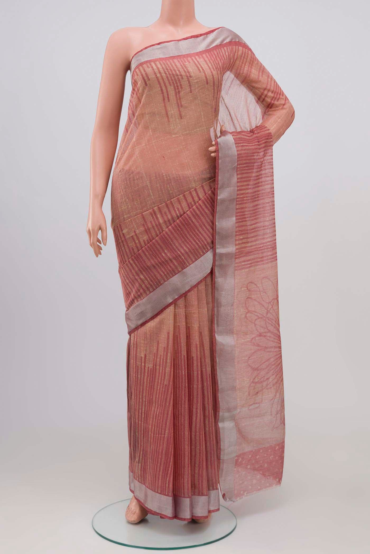 Peach Blended Tussar Silk Saree with Printed design on the body and Zari Border.  displayed on a mannequin