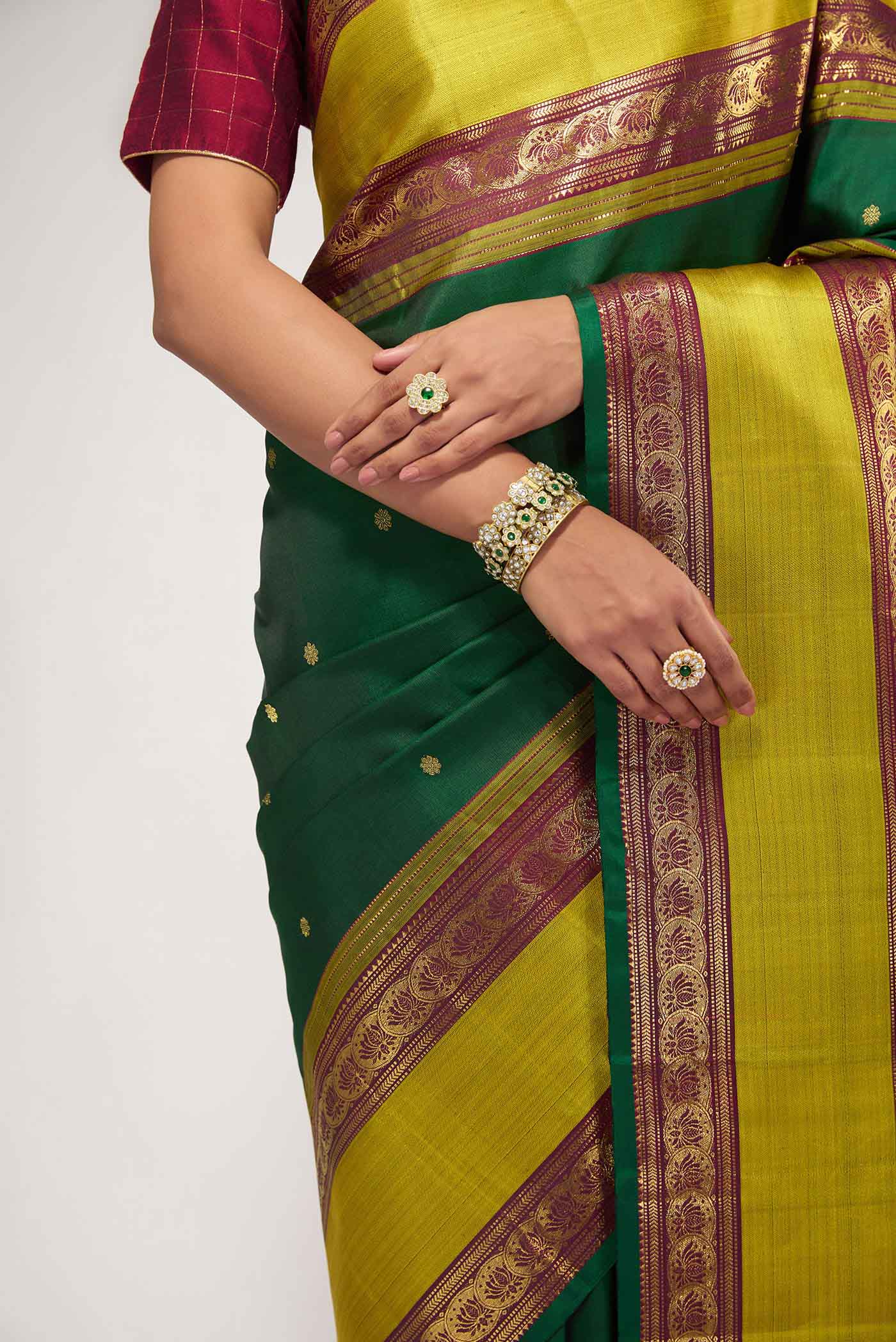 Close up of Green Pure Organza Silk Saree with Bird Print on the body and Without Border displaying folds