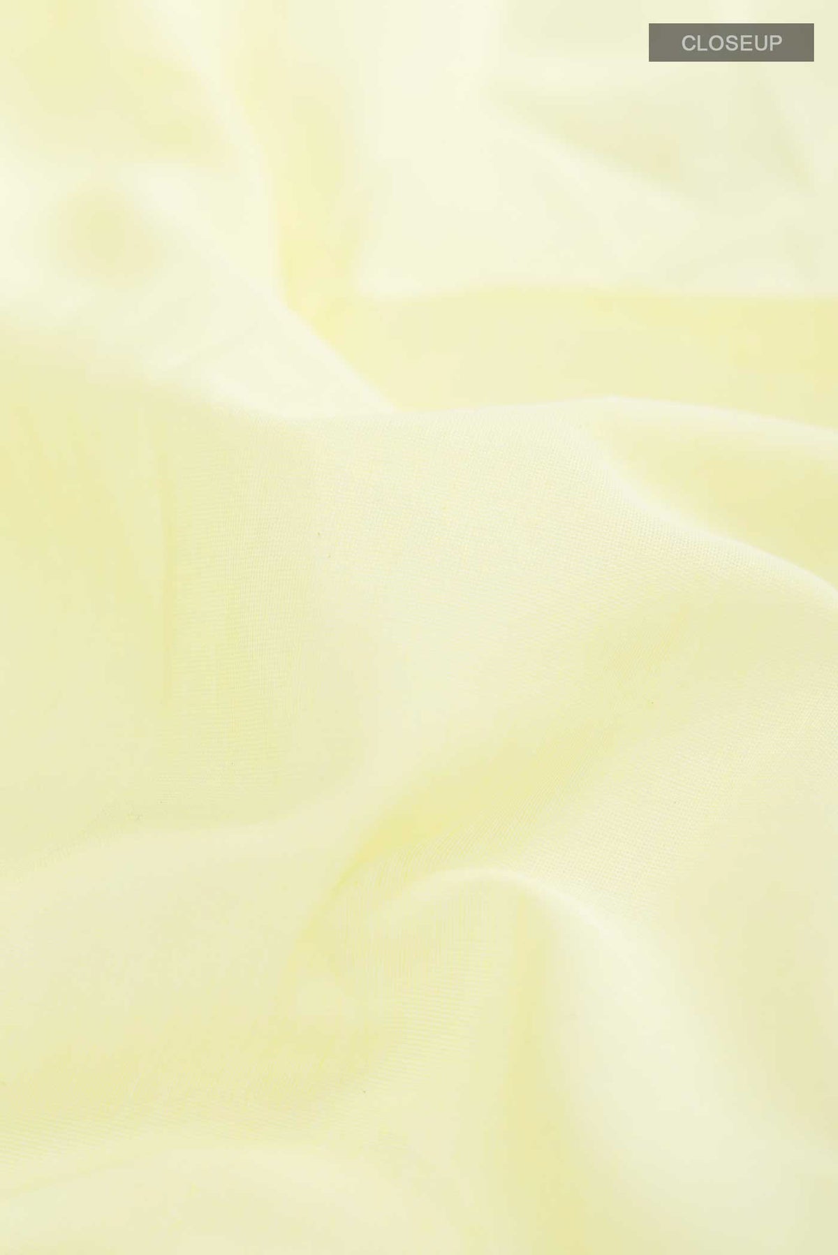 Close up of Lemon Yellow Bengal Cotton Saree with Jamdani on the body and Zari Border displaying folds