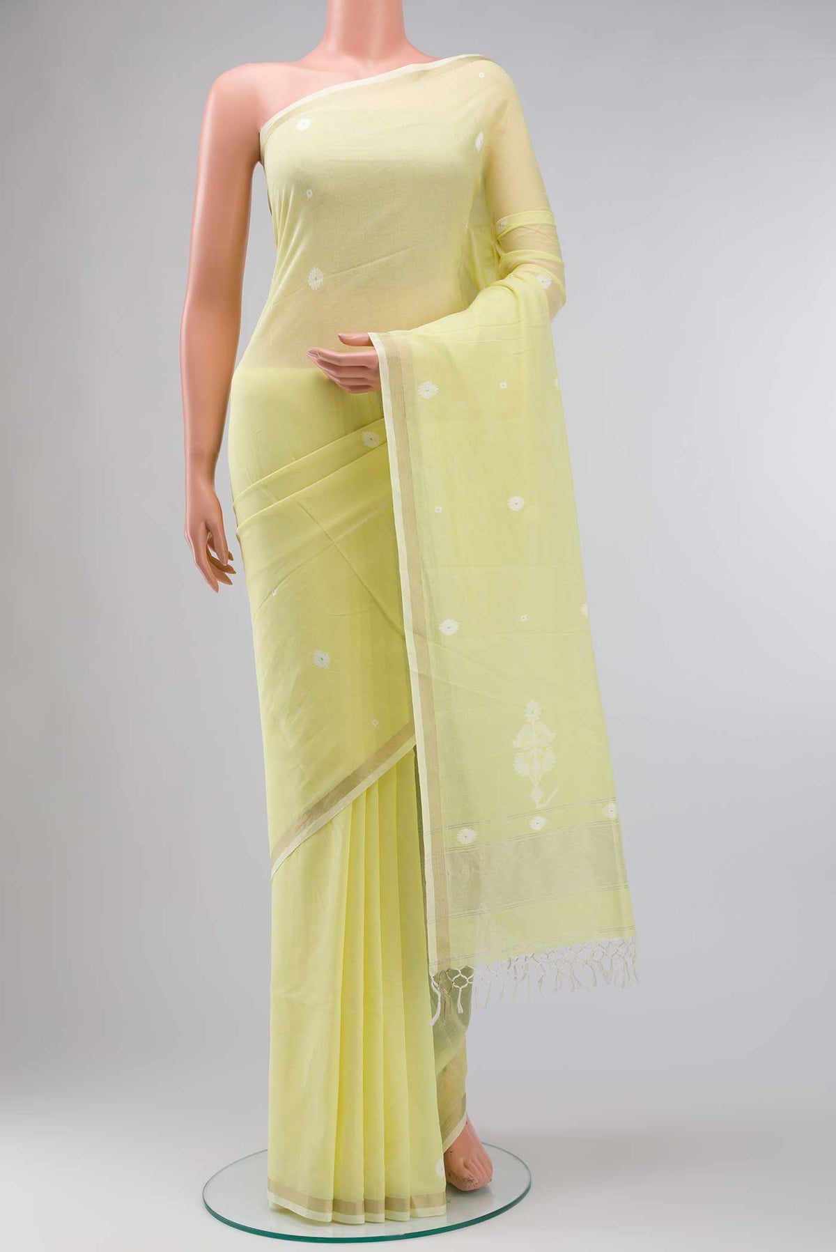 Lemon Yellow Bengal Cotton Saree with Jamdani on the body and Zari Border displayed on a mannequin
