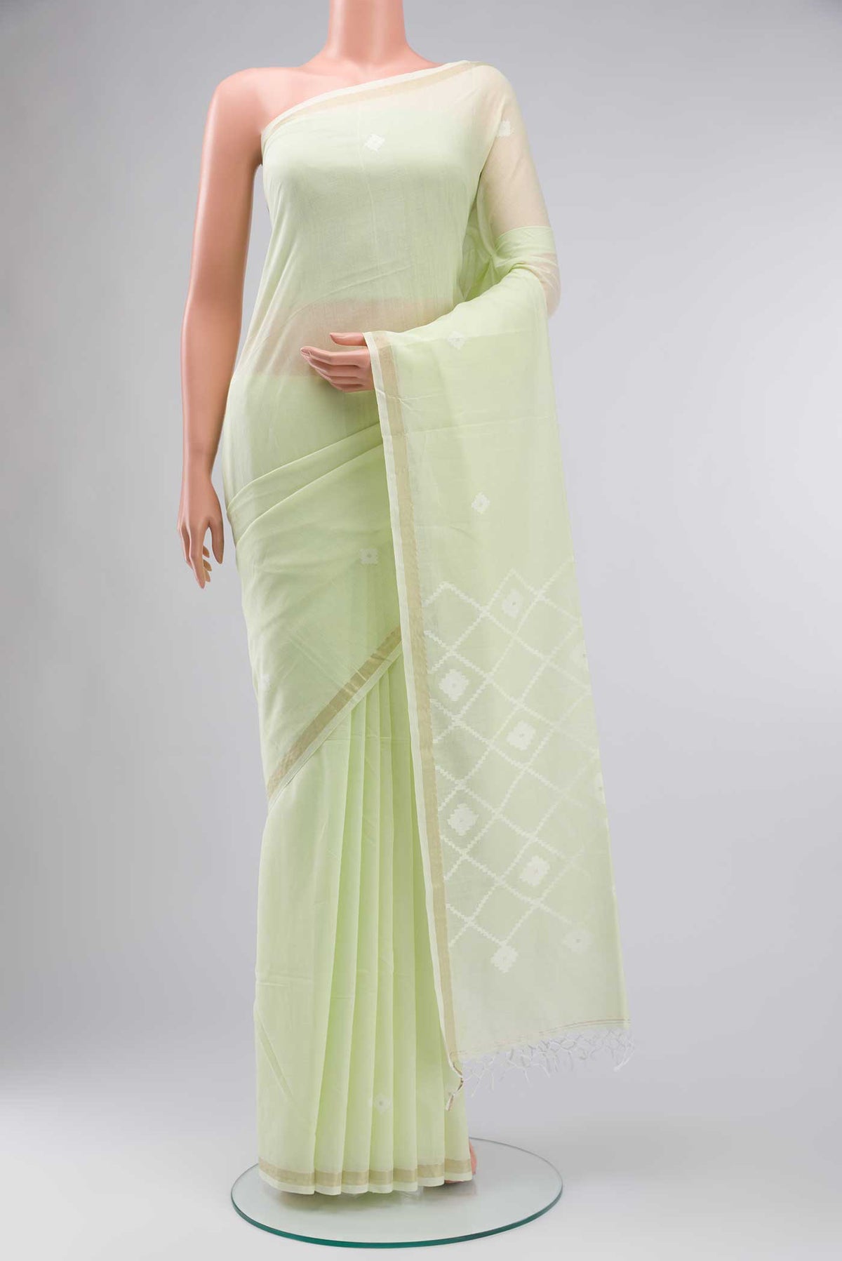 Light Green Bengal Cotton Saree with Plain Body and Zari Border displayed on a mannequin