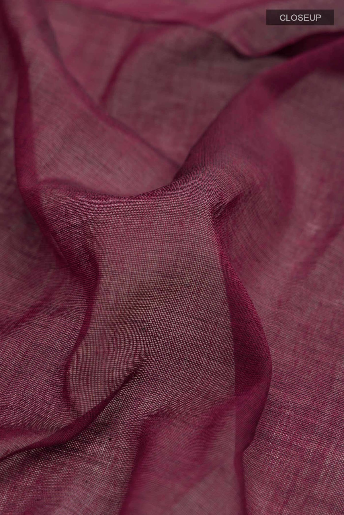 Close up of Maroon Bengal Cotton Saree with Plain Body and Zari Border displaying folds