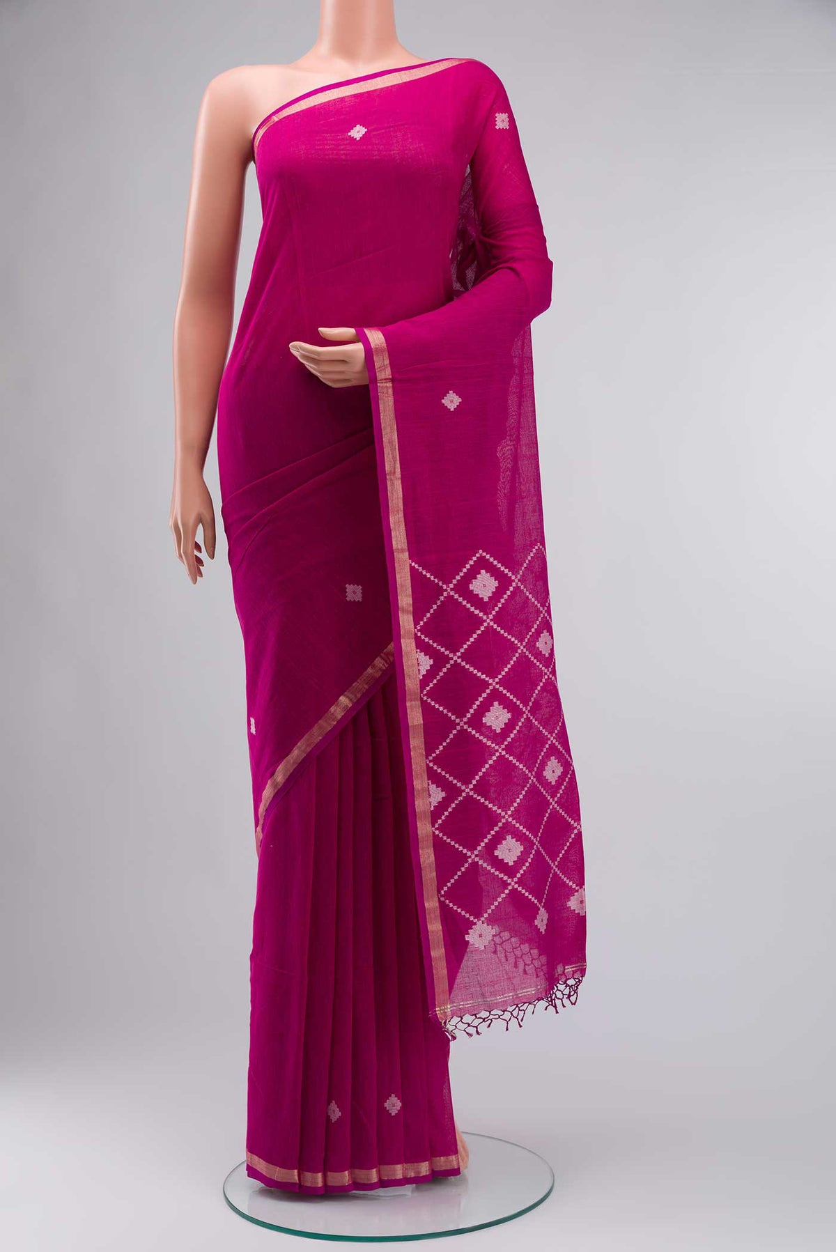 Magenta Bengal Cotton Saree with Plain Body and Zari Border displayed on a mannequin