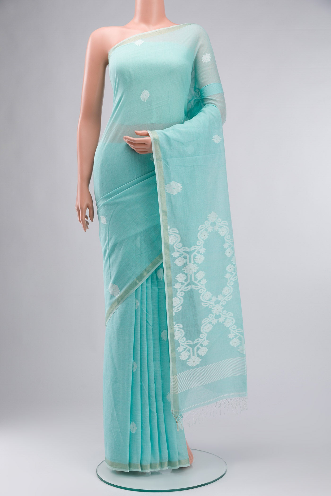 Sea Green Bengal Cotton Saree with Thread Butta on the body and Zari Border displayed on a mannequin