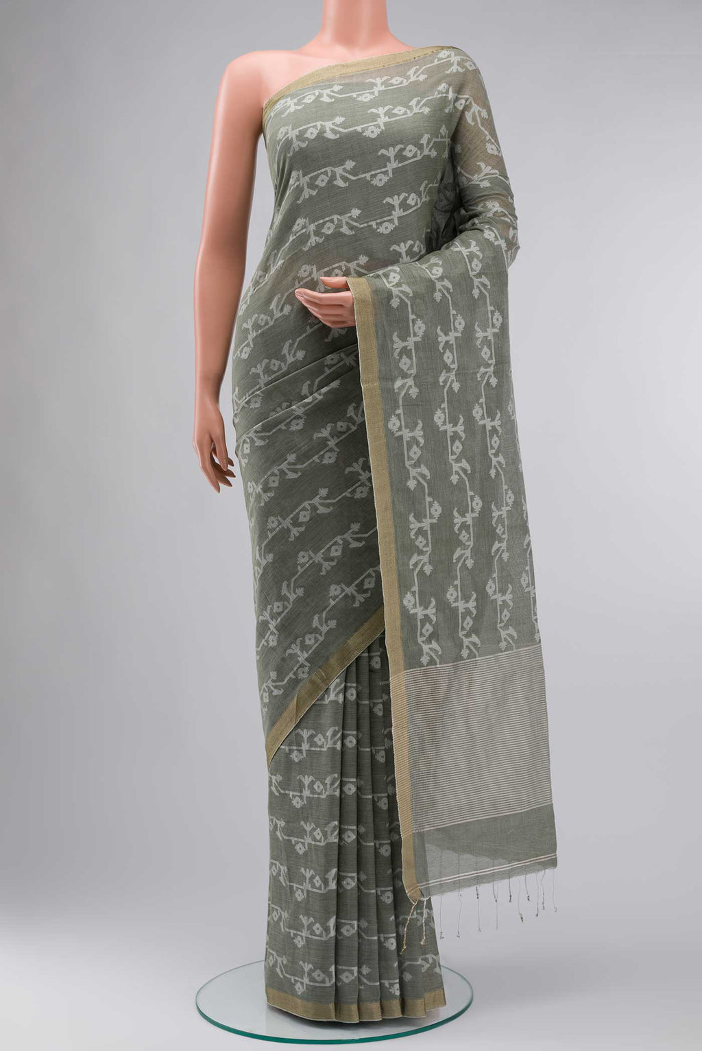 Olive Green Bengal Cotton Saree with Jamdani on the body and Zari Border displayed on a mannequin