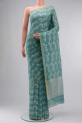Green Bengal Cotton Saree with Jamdani on the body and Zari Border displayed on a mannequin