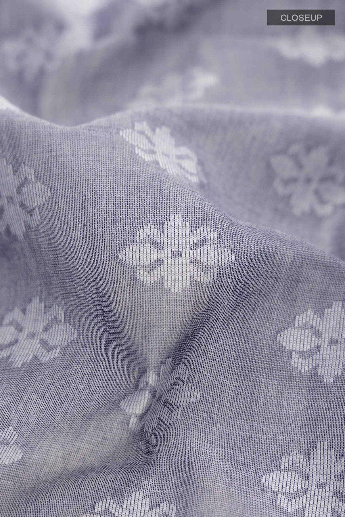 Close up of Blue Bengal Cotton Saree with Jamdani on the body and Thread Border displaying folds