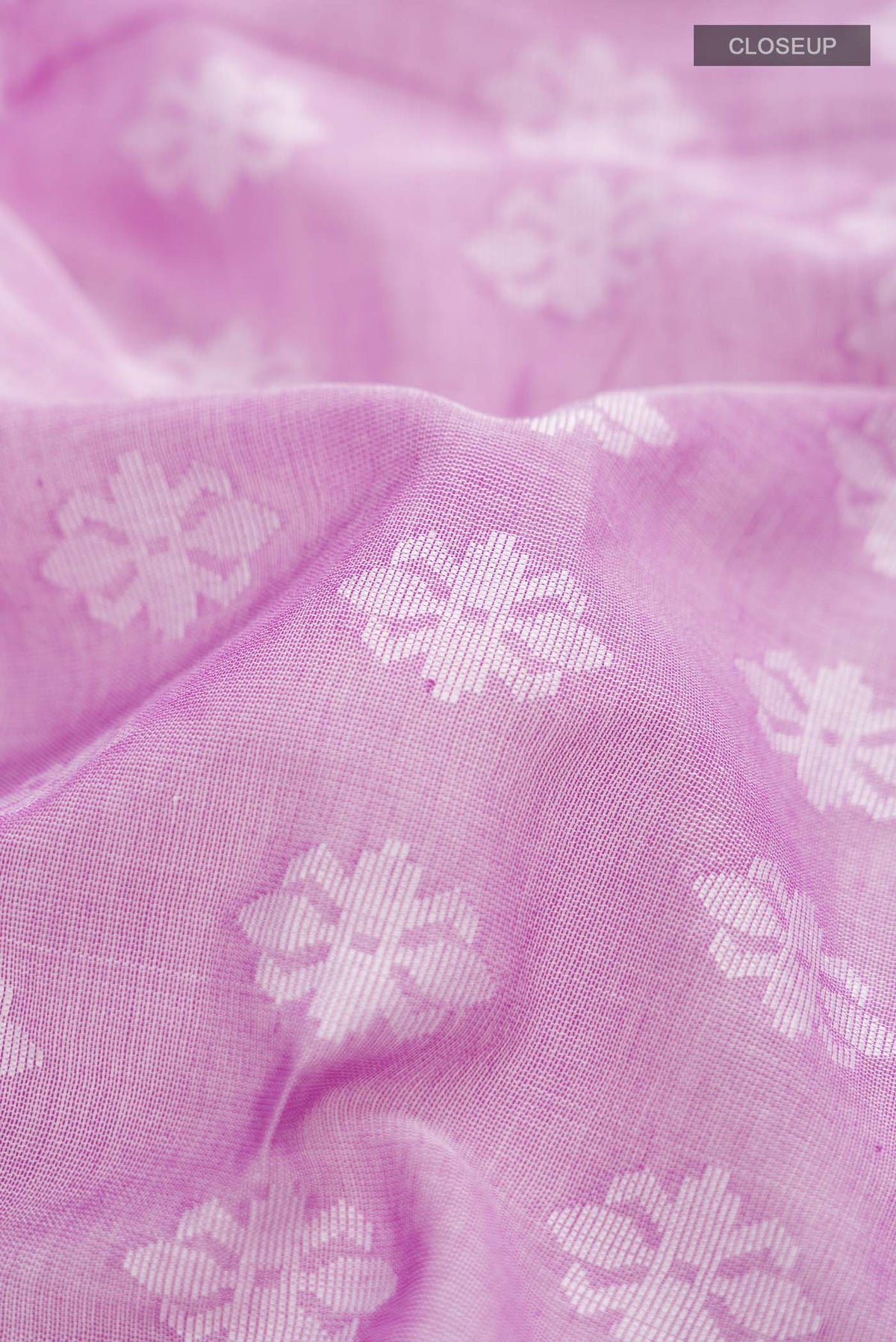 Close up of Purple Bengal Cotton Saree with Jamdani on the body and Thread Border displaying folds