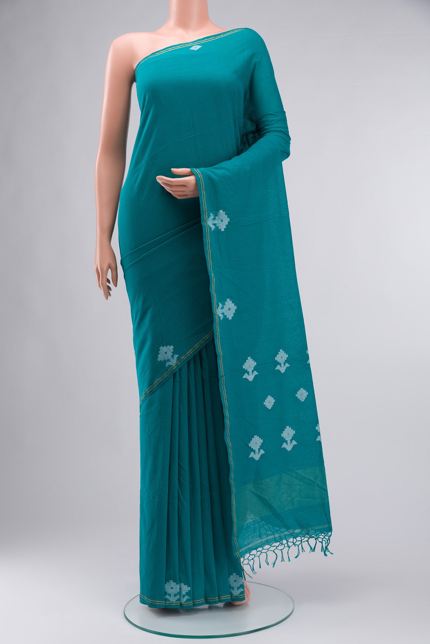Teal Bengal Cotton Saree with Plain Body and Zari Border displayed on a mannequin