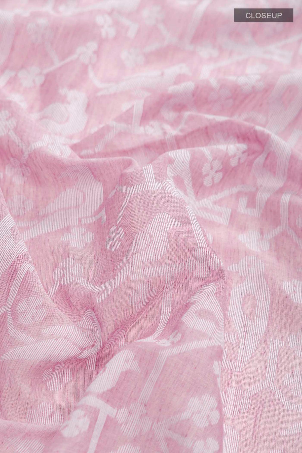 Close up of Mauve Bengal Cotton Saree with Jamdani on the body and Thread Border displaying folds
