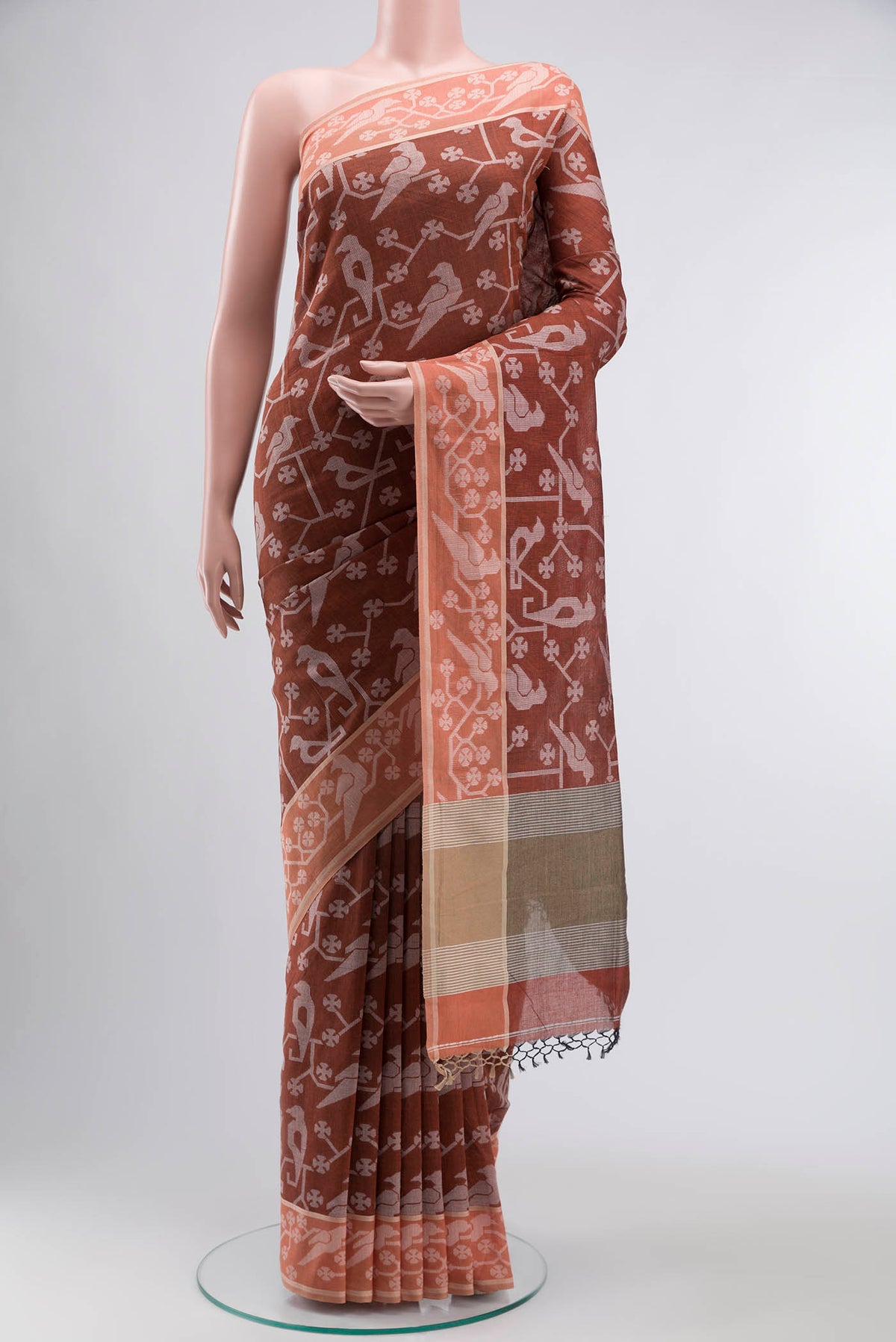 Rust Bengal Cotton Saree with Jamdani on the body and Thread Border displayed on a mannequin