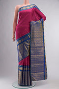 Pink Kanchipuram Silk Saree with Zari Butta on the body and Zari Border displayed on a mannequin