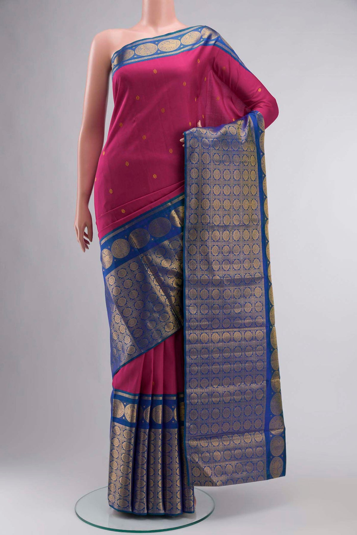 Pink Kanchipuram Silk Saree with Zari Butta on the body and Zari Border displayed on a mannequin
