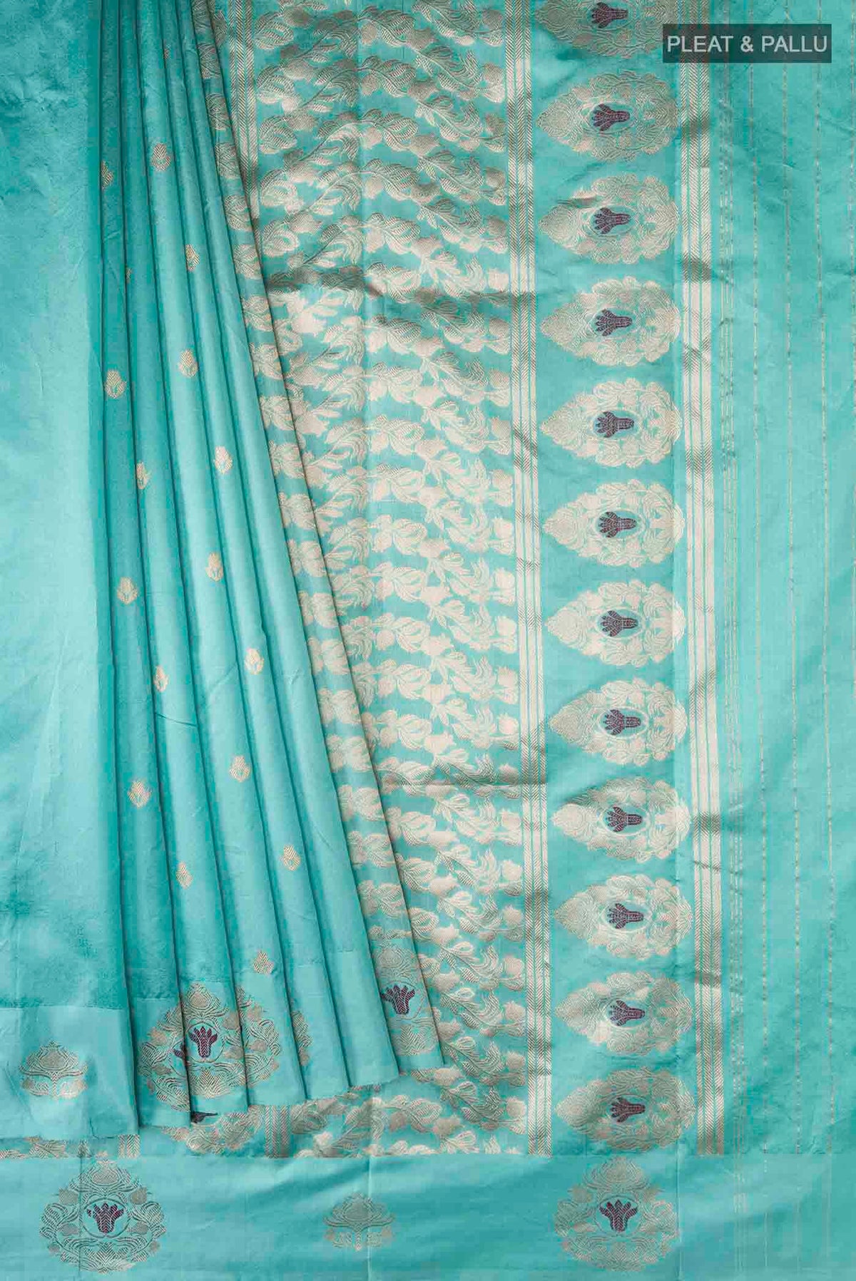 Pleats and pallu of Turquoise Banarasi Katan Silk Saree with Zari Butta on the body and Zari Border