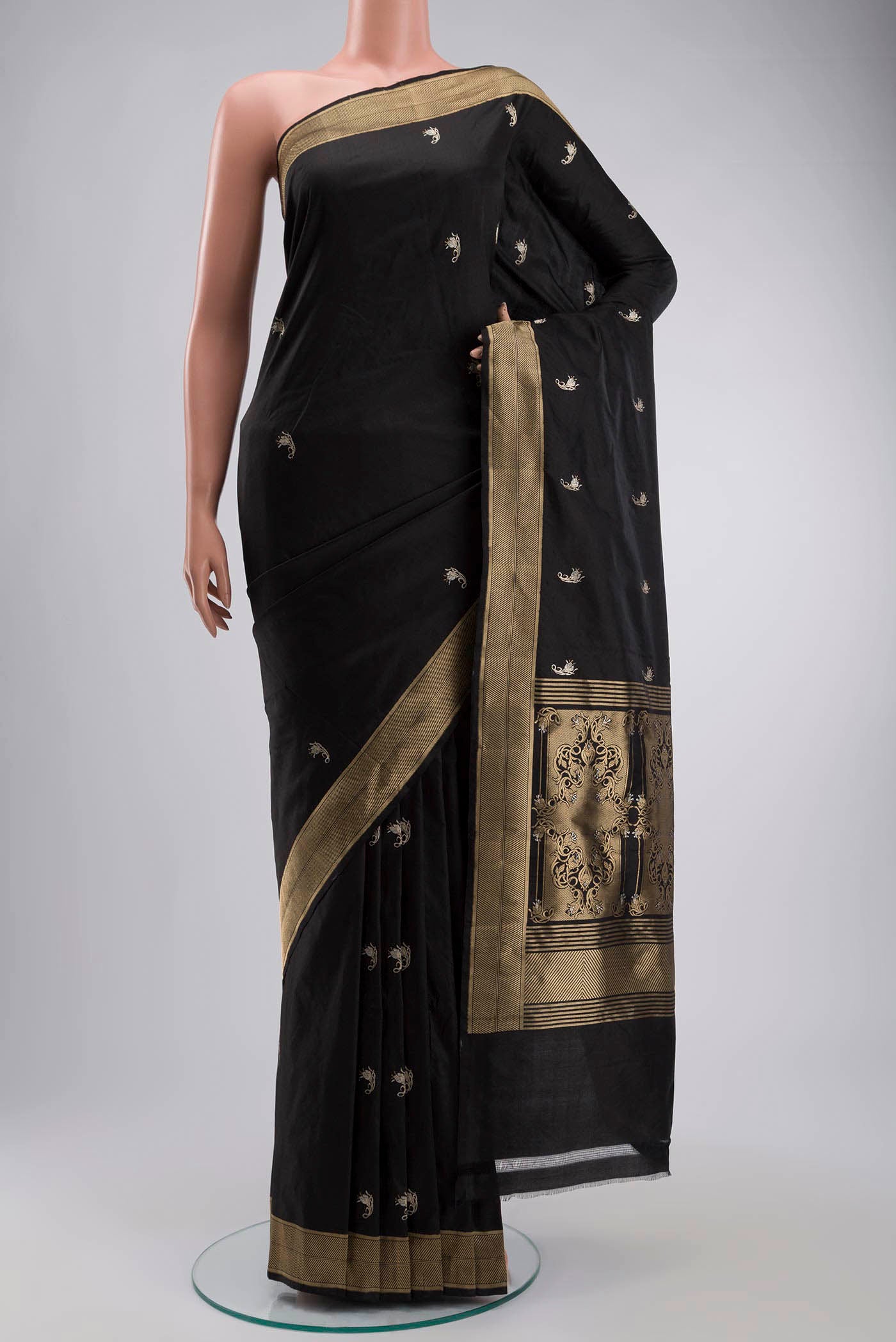 Black Banarasi Katan Silk Saree with Zari Butta on the body and Zari Border displayed on a mannequin