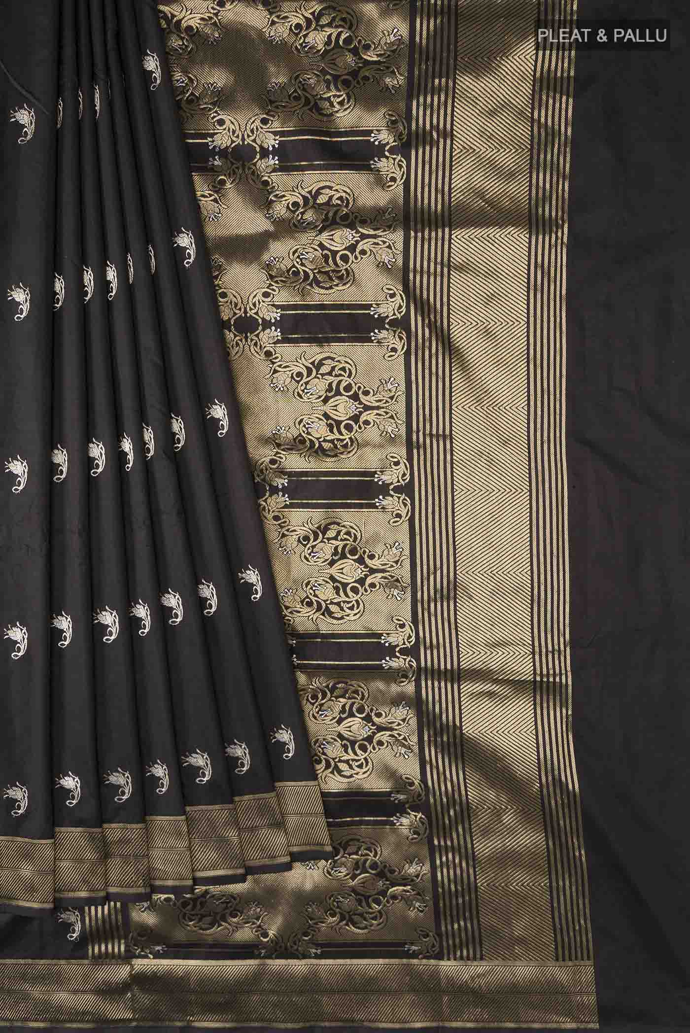 Pleats and pallu of Black Banarasi Katan Silk Saree with Zari Butta on the body and Zari Border
