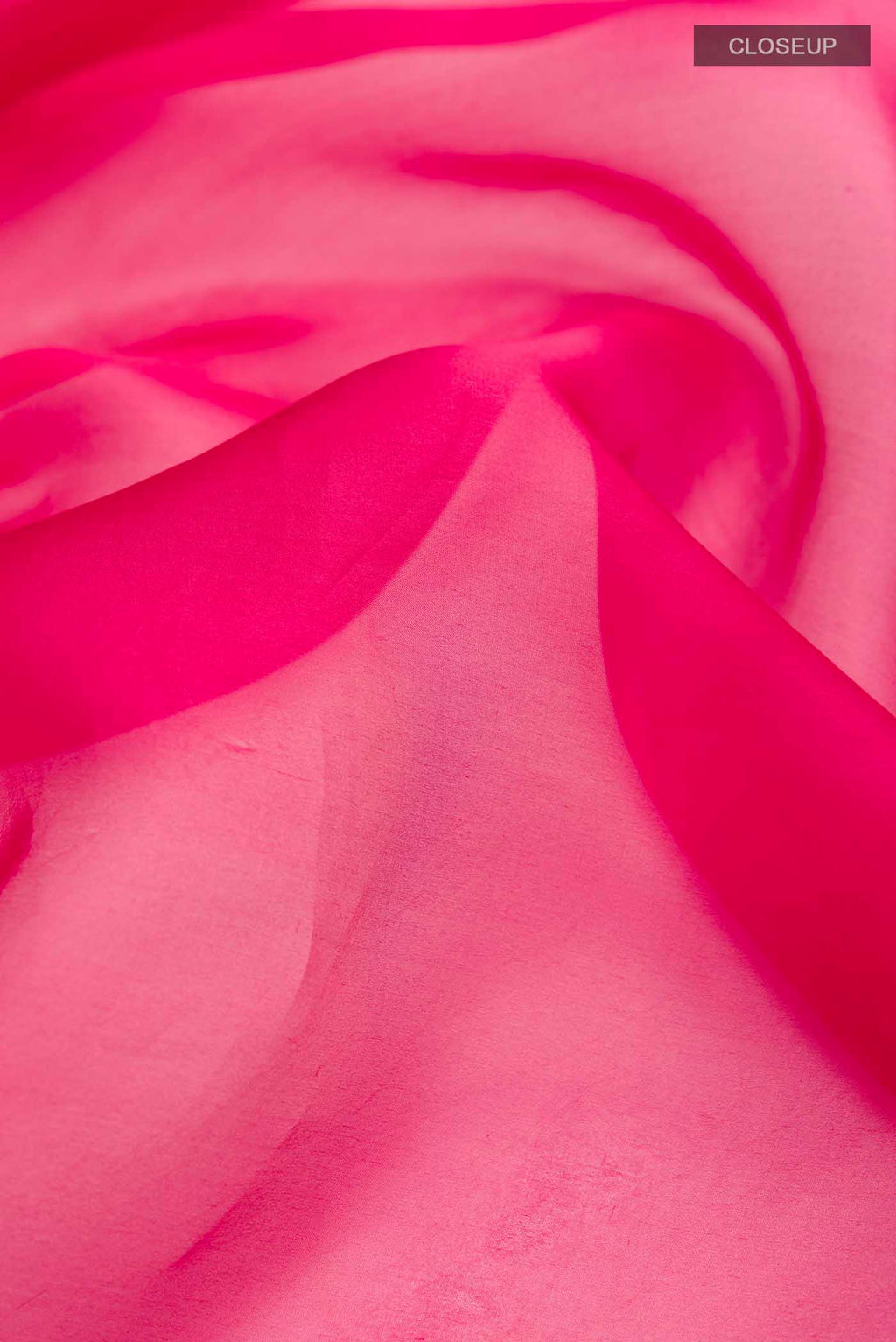Close up of Bahar, crafted in silk organza, features delicate pani-zari enriched with zardozi, gota work, and dabka embroidery Its defining element is an off-center floral vine running vertically through the body, breaking symmetry with quiet intent Inspired by Art Nouveau?s flowing lines, the vine is rendered in slender leaves, zari chain-stitched stems, and alternating gota and zardozi flowers The pallu trails gently onto the body in scattered embroidered blooms displaying folds