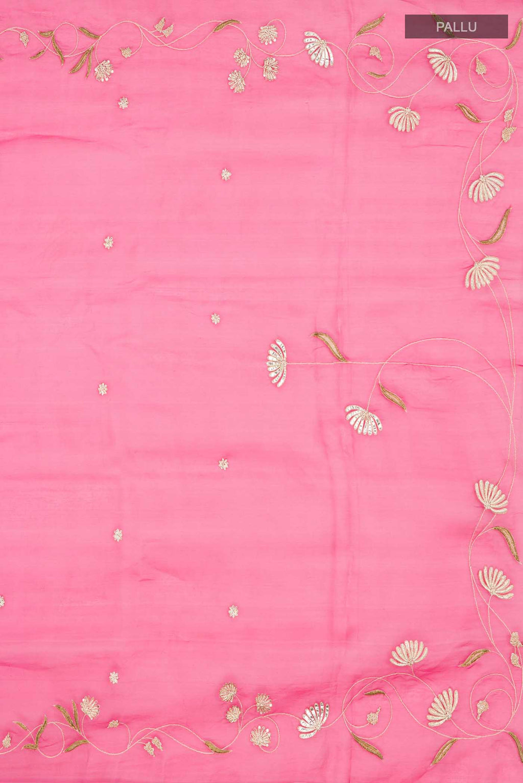 Close up image of the pallu of Bahar, crafted in silk organza, features delicate pani-zari enriched with zardozi, gota work, and dabka embroidery Its defining element is an off-center floral vine running vertically through the body, breaking symmetry with quiet intent Inspired by Art Nouveau?s flowing lines, the vine is rendered in slender leaves, zari chain-stitched stems, and alternating gota and zardozi flowers The pallu trails gently onto the body in scattered embroidered blooms