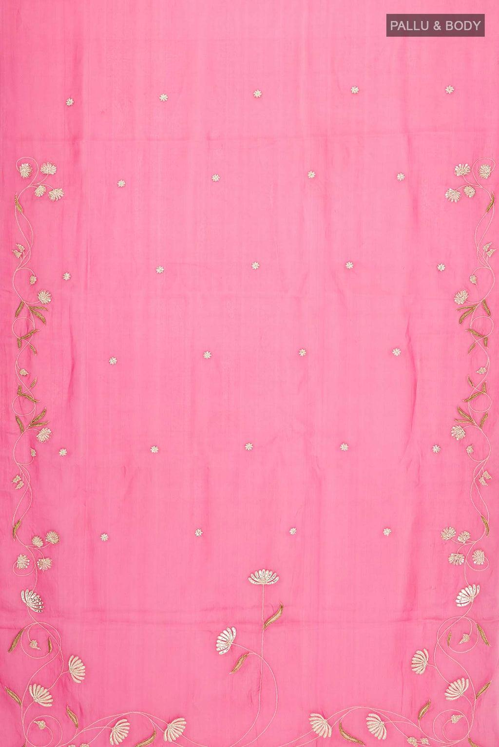 Flat view of Bahar, crafted in silk organza, features delicate pani-zari enriched with zardozi, gota work, and dabka embroidery Its defining element is an off-center floral vine running vertically through the body, breaking symmetry with quiet intent Inspired by Art Nouveau?s flowing lines, the vine is rendered in slender leaves, zari chain-stitched stems, and alternating gota and zardozi flowers The pallu trails gently onto the body in scattered embroidered blooms