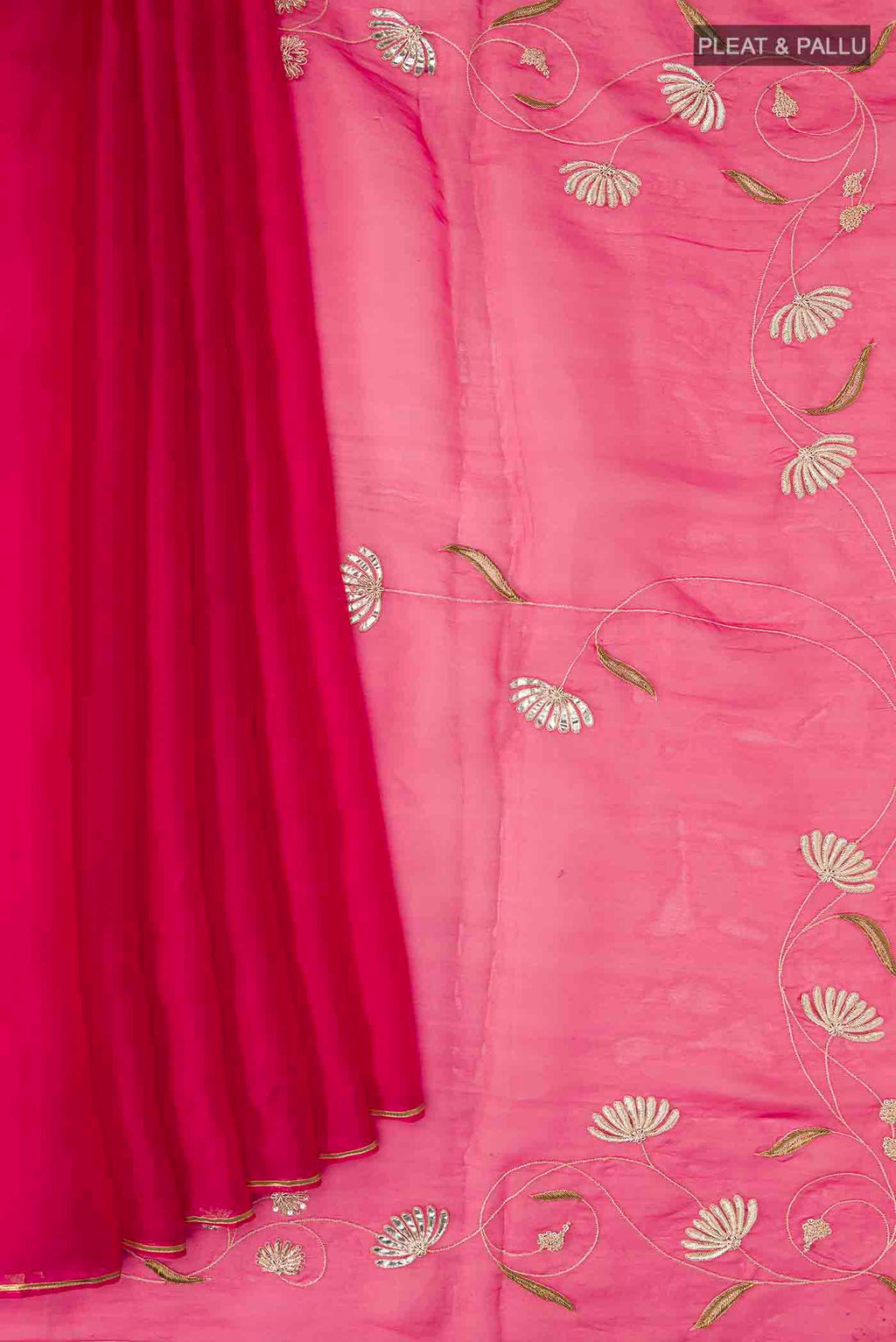 Pleats and pallu of Bahar, crafted in silk organza, features delicate pani-zari enriched with zardozi, gota work, and dabka embroidery Its defining element is an off-center floral vine running vertically through the body, breaking symmetry with quiet intent Inspired by Art Nouveau?s flowing lines, the vine is rendered in slender leaves, zari chain-stitched stems, and alternating gota and zardozi flowers The pallu trails gently onto the body in scattered embroidered blooms