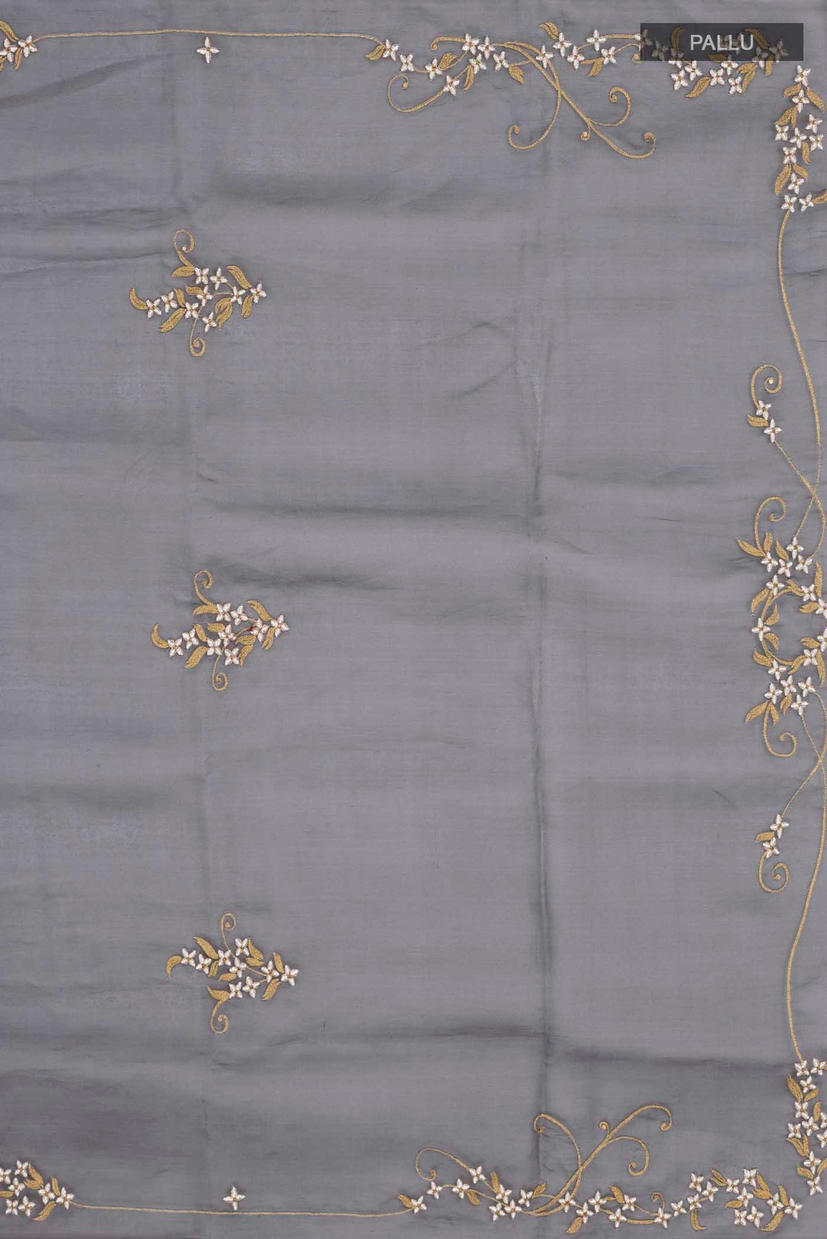 Close up image of the pallu of Black Organza Silk Saree with Plain Body and Embroidery Border
