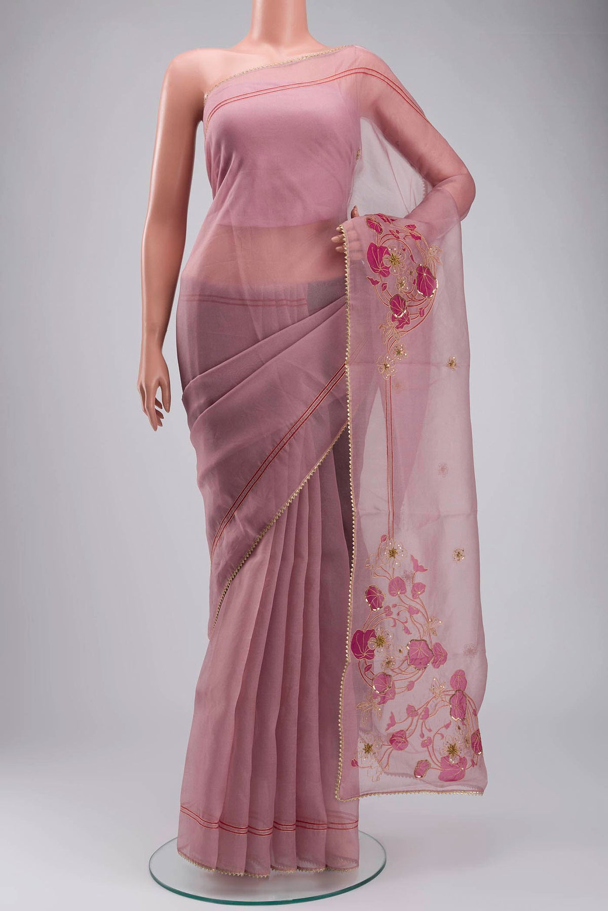 Mauve Organza Silk Saree with Plain Body and Embroidery Border displayed on a mannequin