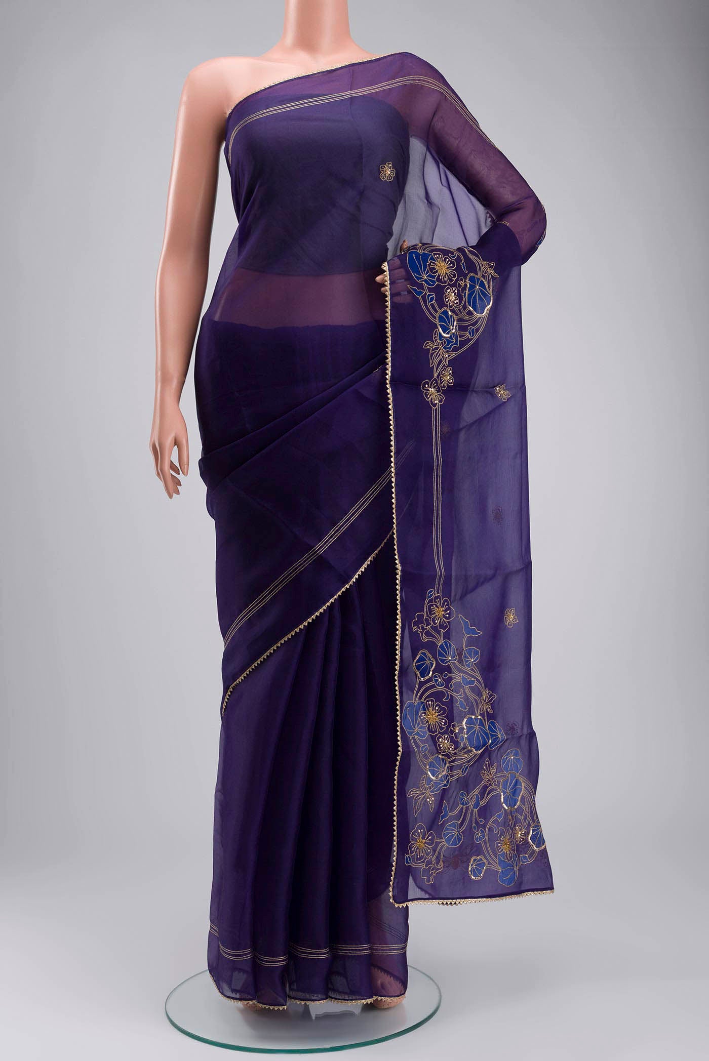 Navy Blue Organza Silk Saree with Plain Body and Embroidery Border displayed on a mannequin