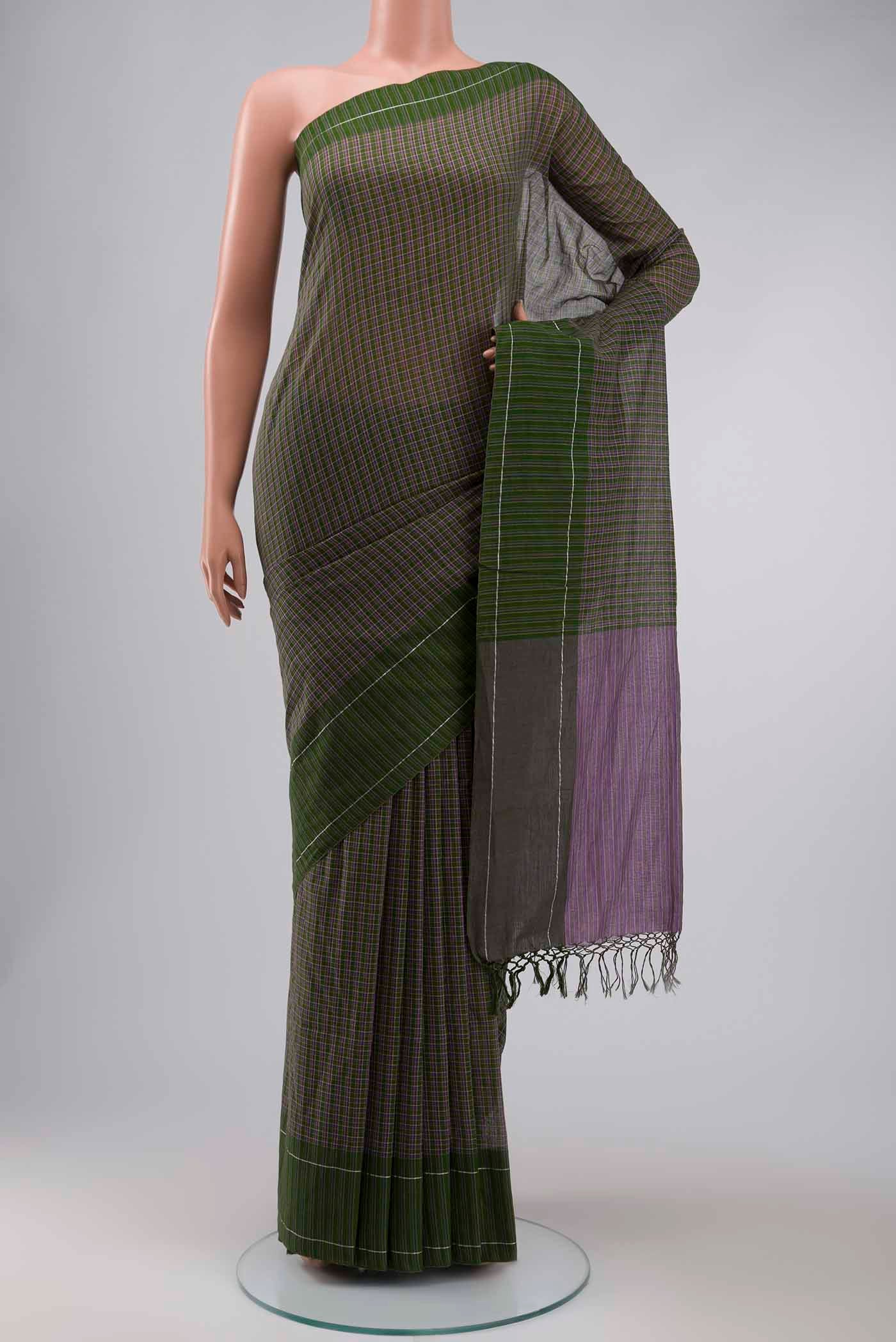 Patang features fine multi-coloured checks woven using four harmonious hues, creating a lively yet balanced design Translating to ?te)n Hindi, the saree reflects the light, easy spirit of a patang gliding across an open sky The border and pallu are minimal, finished with delicate zari accents that add subtle richness With its balanced play of colour, it makes for a breathable, comfortable drape displayed on a mannequin