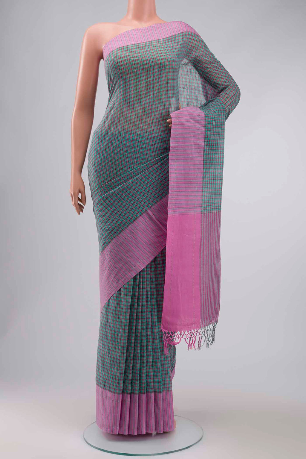 Patang features fine multi-coloured checks woven using four harmonious hues, creating a lively yet balanced design Translating to ?te)n Hindi, the saree reflects the light, easy spirit of a patang gliding across an open sky The border and pallu are minimal, finished with delicate zari accents that add subtle richness With its balanced play of colour, it makes for a breathable, comfortable drape displayed on a mannequin