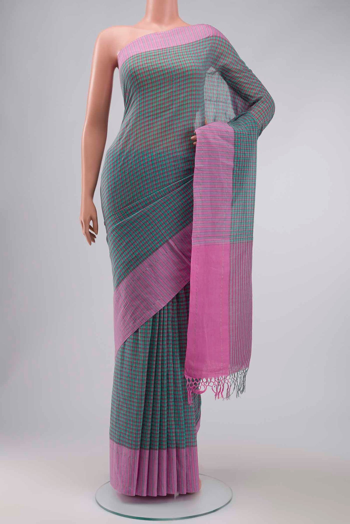 Patang features fine multi-coloured checks woven using four harmonious hues, creating a lively yet balanced design Translating to ?te)n Hindi, the saree reflects the light, easy spirit of a patang gliding across an open sky The border and pallu are minimal, finished with delicate zari accents that add subtle richness With its balanced play of colour, it makes for a breathable, comfortable drape displayed on a mannequin