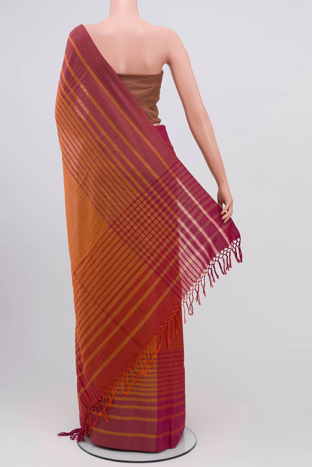 Pleats and pallu of Titli, framed with proportioned stripes that gradually narrow towards the body, bringing together a vibrant palette in harmony Where the border and pallu stripes meet, tiny checks appear, evoking abstract butterflies - delicate creatures of spring and summer The plain body offers soft contrast, allowing the colours to shine On the pallu, these stripes return as subtle checks, adding a light, balanced finish
