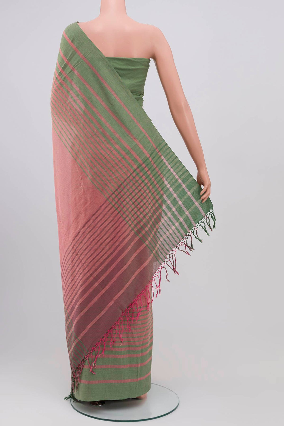 Pleats and pallu of Titli, framed with proportioned stripes that gradually narrow towards the body, bringing together a vibrant palette in harmony Where the border and pallu stripes meet, tiny checks appear, evoking abstract butterflies - delicate creatures of spring and summer The plain body offers soft contrast, allowing the colours to shine On the pallu, these stripes return as subtle checks, adding a light, balanced finish
