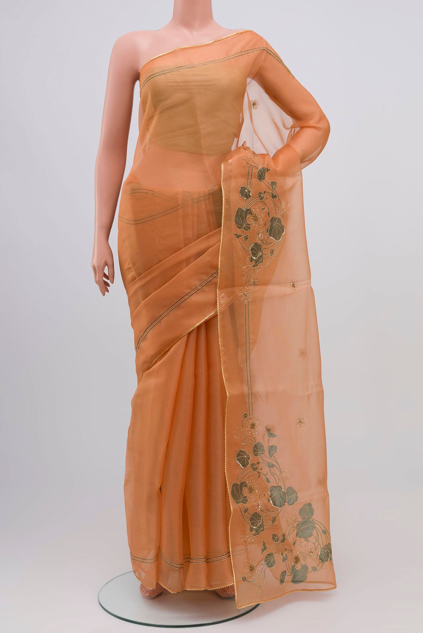 Orange Organza Silk Saree with Plain Body and Attached Border displayed on a mannequin