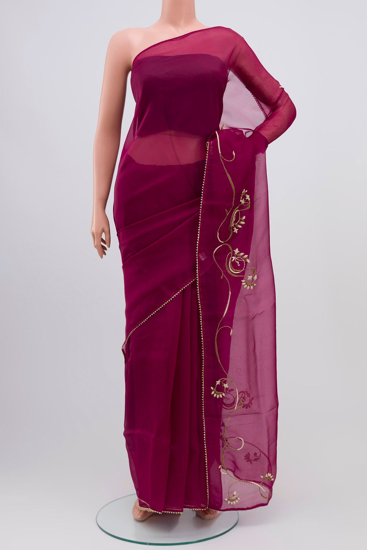 Purple Organza Silk Saree with Embroidery on the body and Attached Border displayed on a mannequin