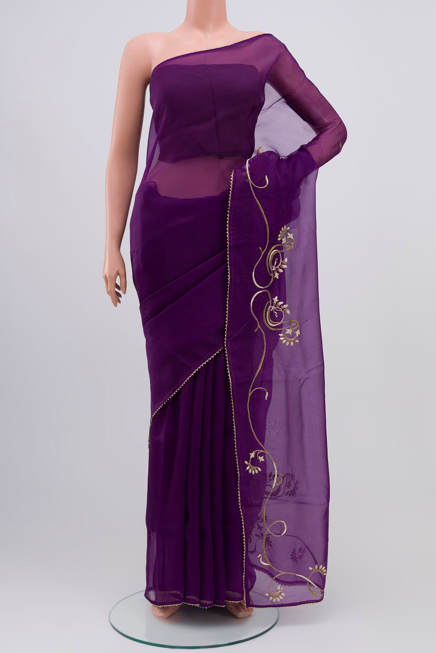 Violet Organza Silk Saree with Embroidery on the body and Attached Border displayed on a mannequin
