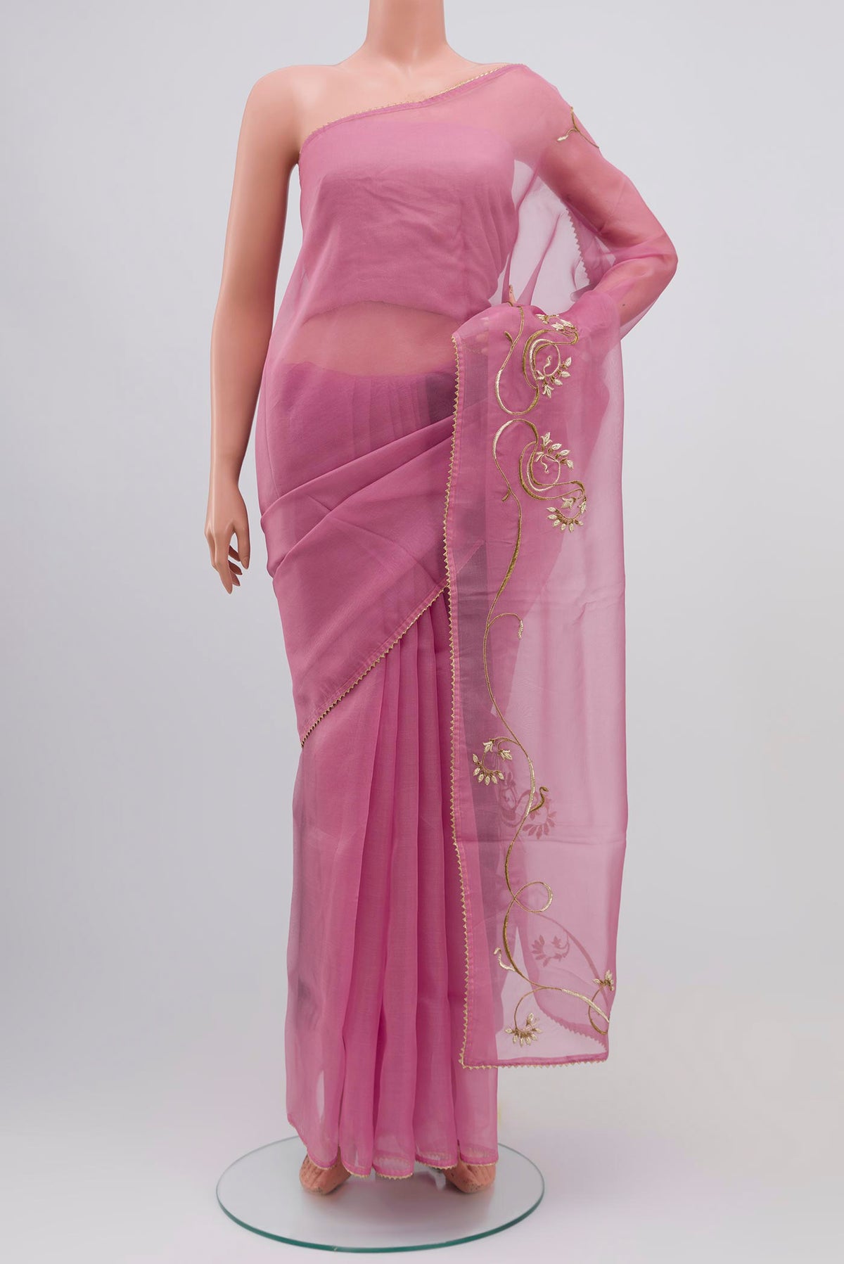 Rose pink Organza Silk Saree with Embroidery on the body and Attached Border displayed on a mannequin