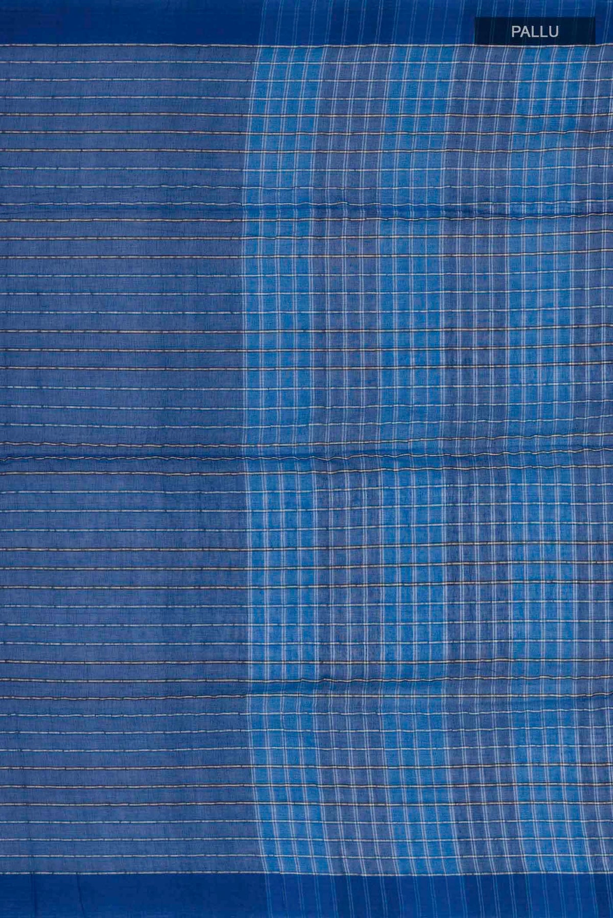Close up image of the pallu of Mishri, a celebration of summer in Bengal cotton, is woven in fine 60-count cotton and drapes with natural comfort Soft stripes move in gentle linear patterns across the fabric, creating a lively yet balanced design The fine checks they form are a gentle reminder of crystal sugar, lending the saree its name Light, breathable, and effortlessly wearable for sunlit days