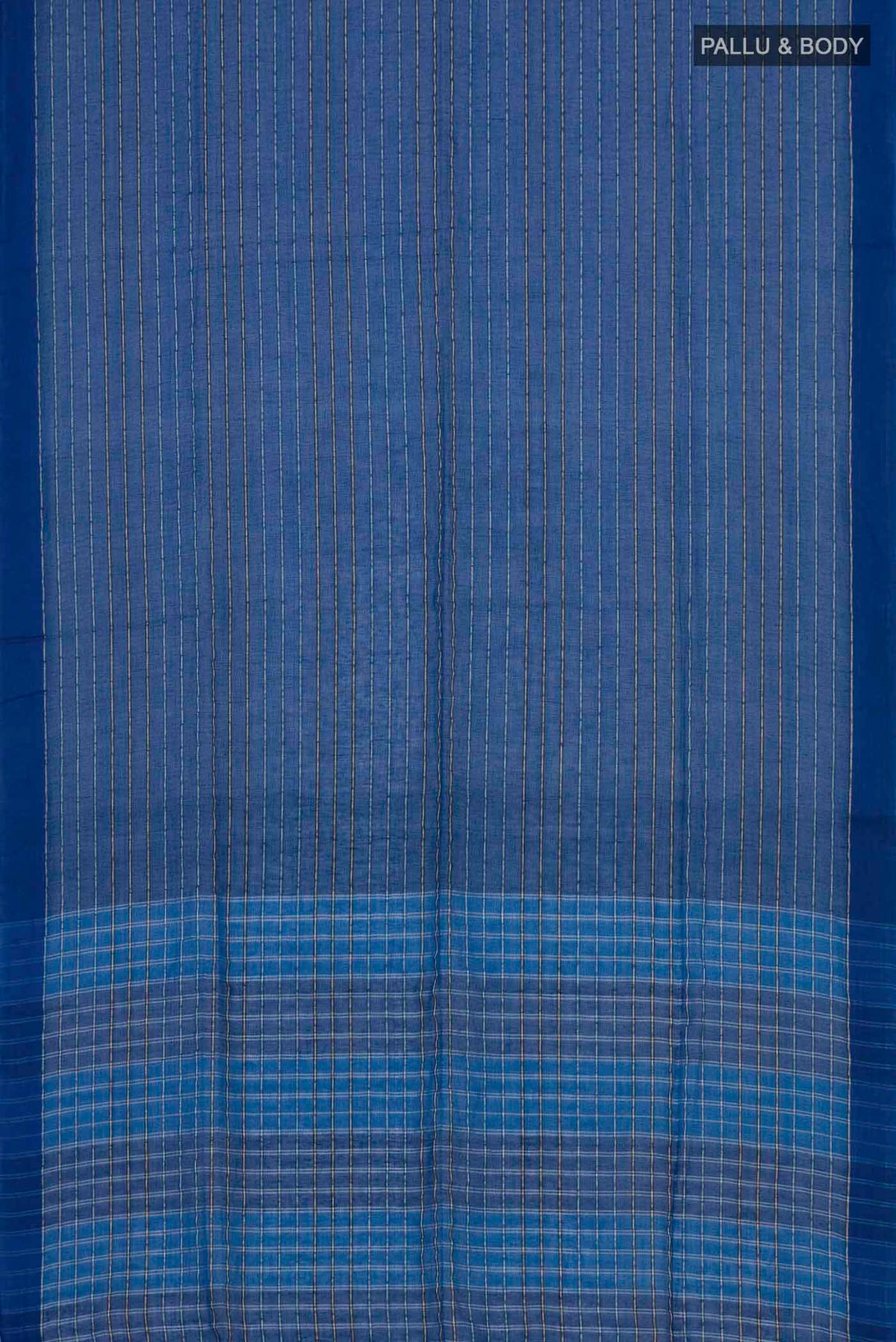 Flat view of Mishri, a celebration of summer in Bengal cotton, is woven in fine 60-count cotton and drapes with natural comfort Soft stripes move in gentle linear patterns across the fabric, creating a lively yet balanced design The fine checks they form are a gentle reminder of crystal sugar, lending the saree its name Light, breathable, and effortlessly wearable for sunlit days