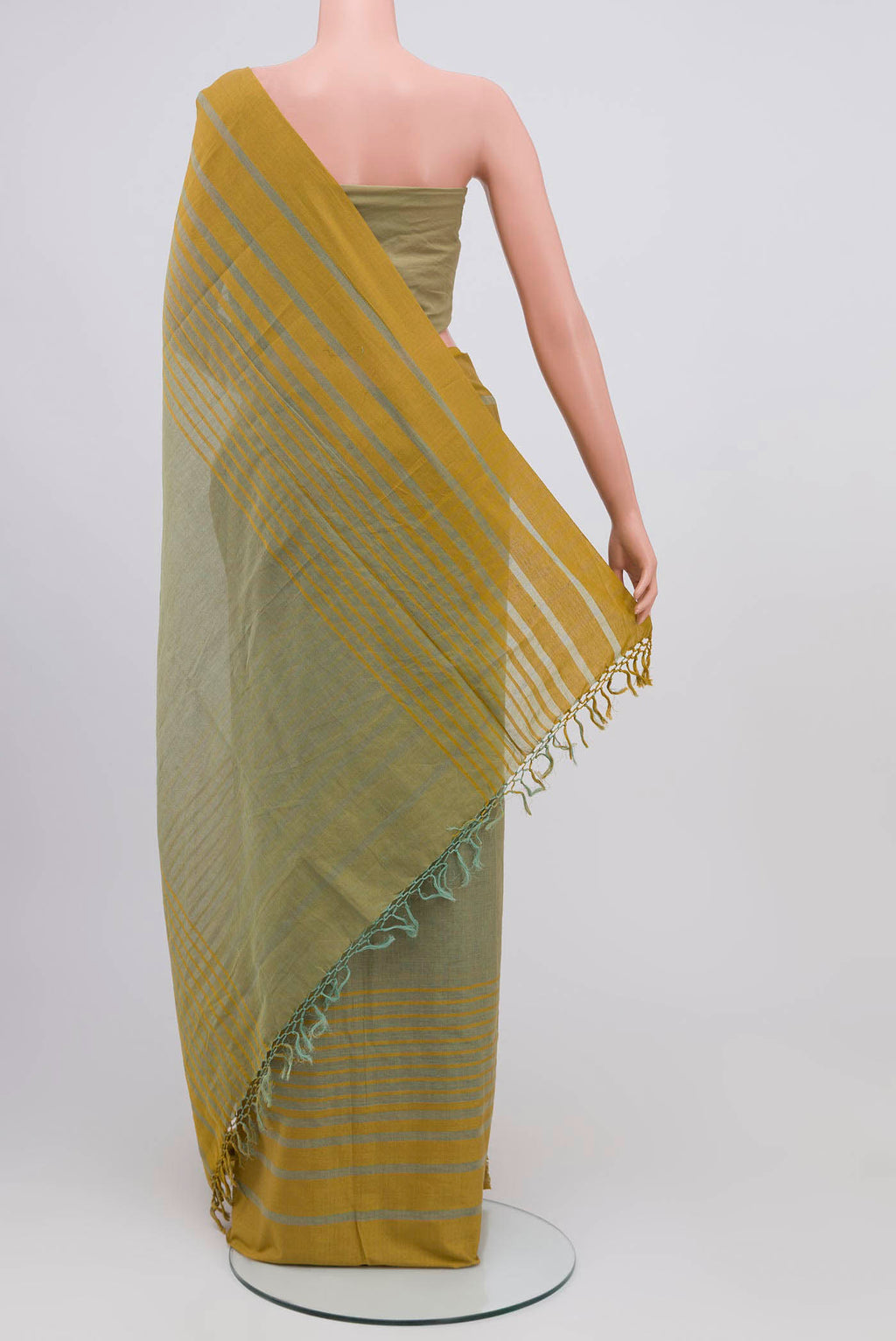 Pleats and pallu of Titli, framed with proportioned stripes that gradually narrow towards the body, bringing together a vibrant palette in harmony Where the border and pallu stripes meet, tiny checks appear, evoking abstract butterflies - delicate creatures of spring and summer The plain body offers soft contrast, allowing the colours to shine On the pallu, these stripes return as subtle checks, adding a light, balanced finish