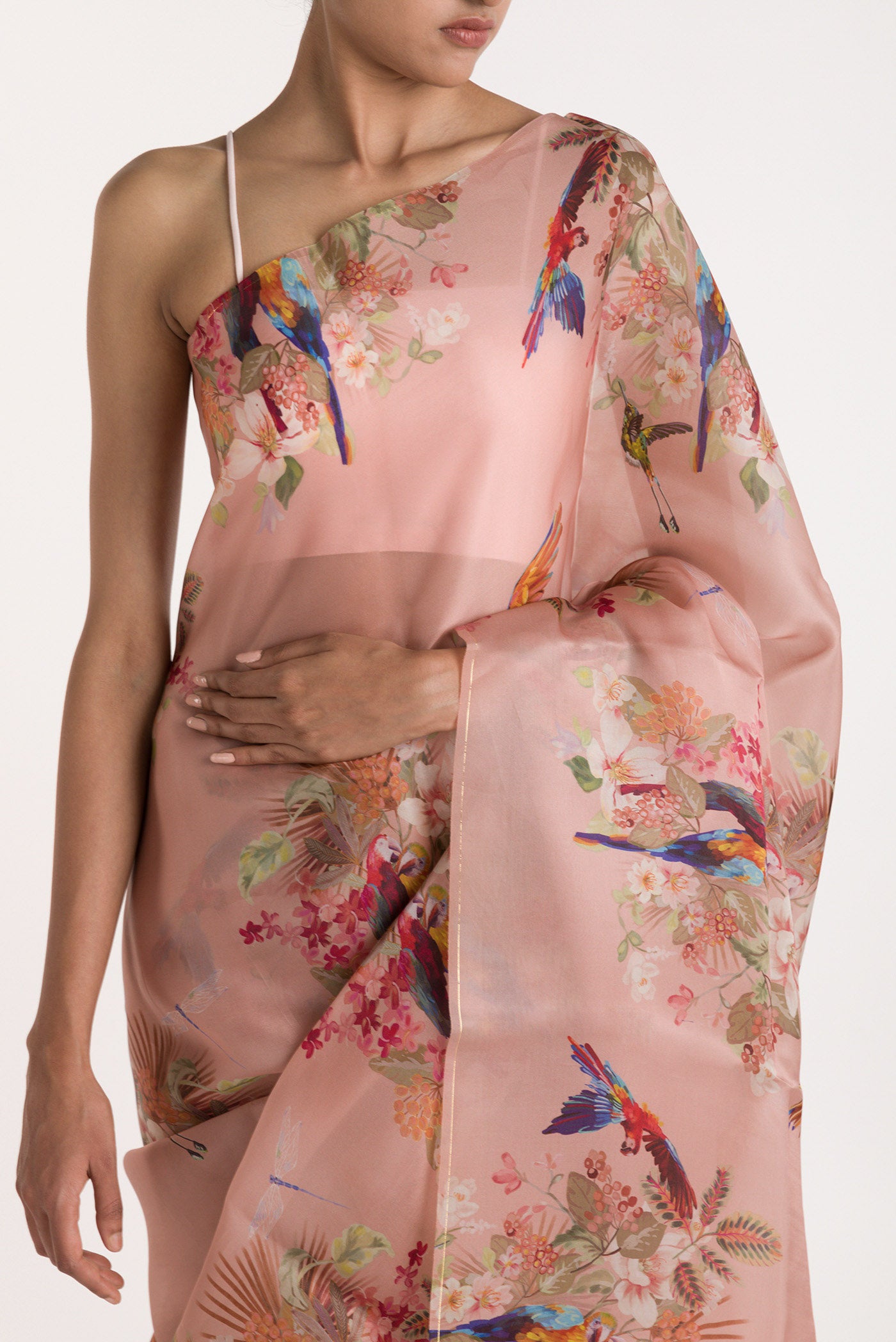 Close up of Peach Satin Organza Saree with Bird Print on the body and Without Border displaying folds