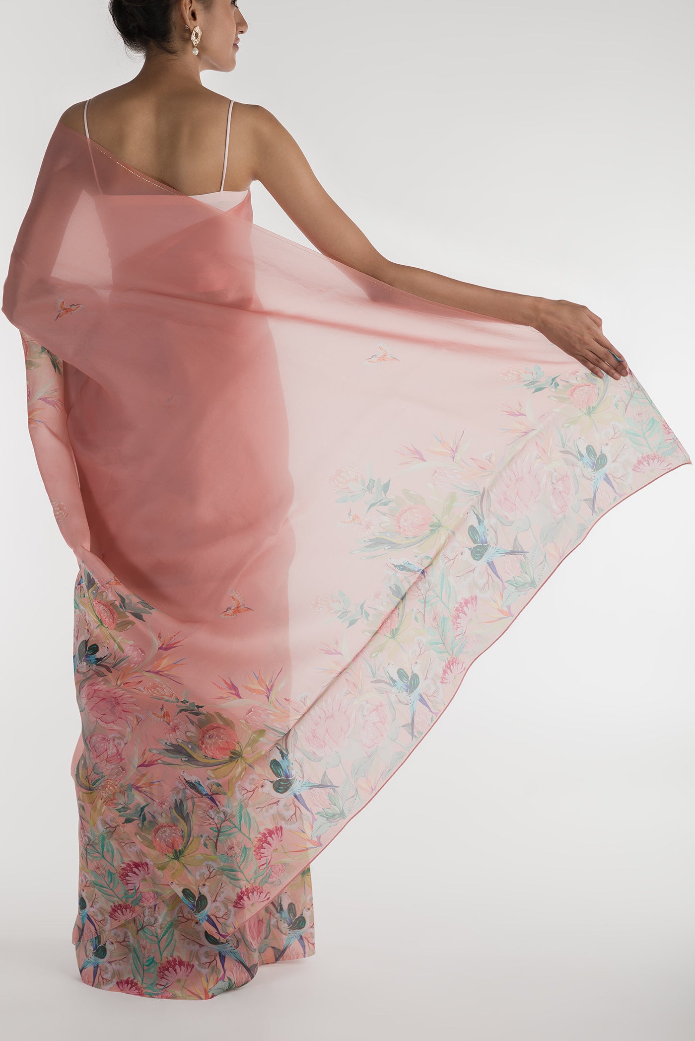 Pleats and pallu of Peach Satin Organza Saree with Bird Print on the body and Without Border