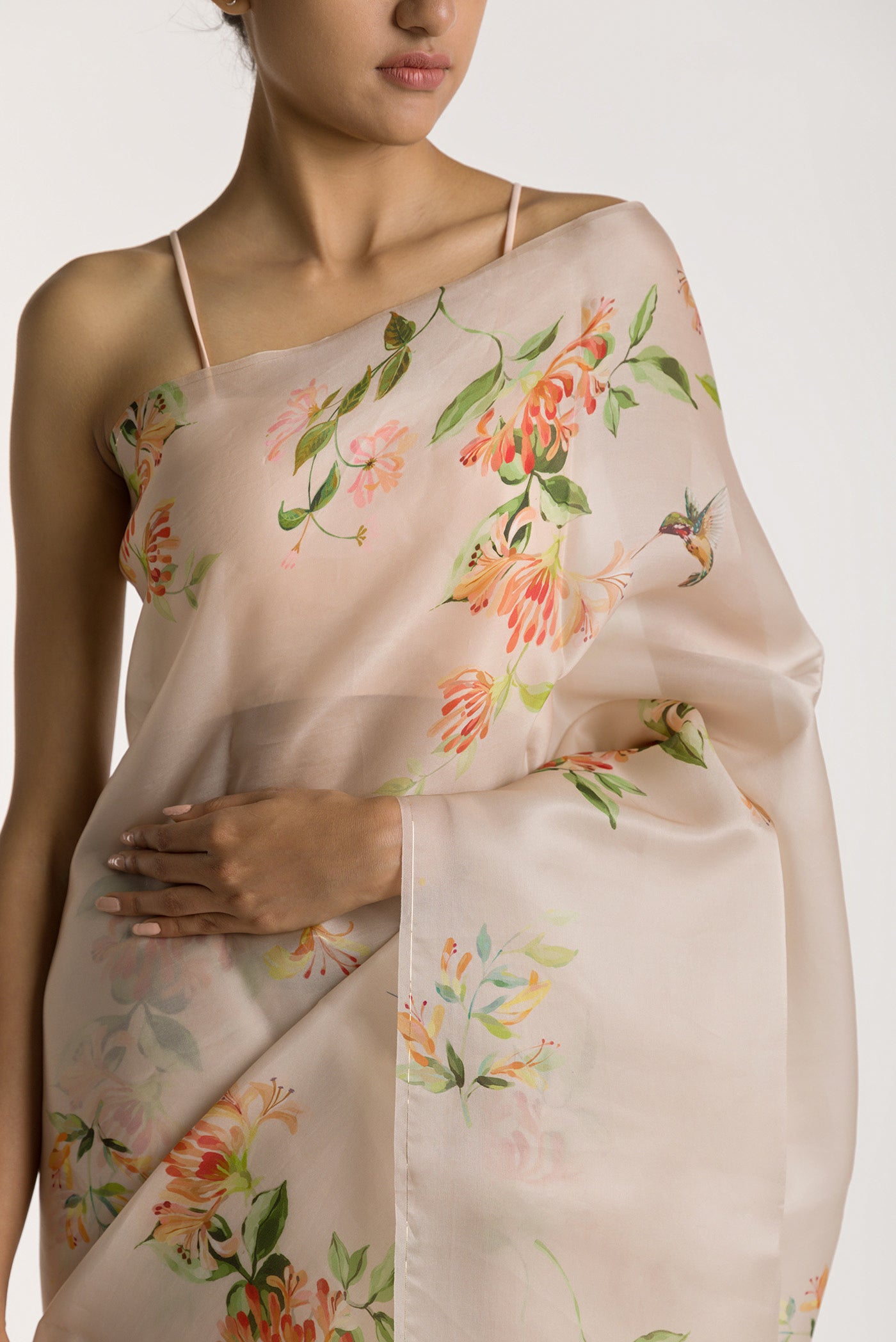 Close up of White Satin Organza Saree with Bird Print on the body and Without Border displaying folds